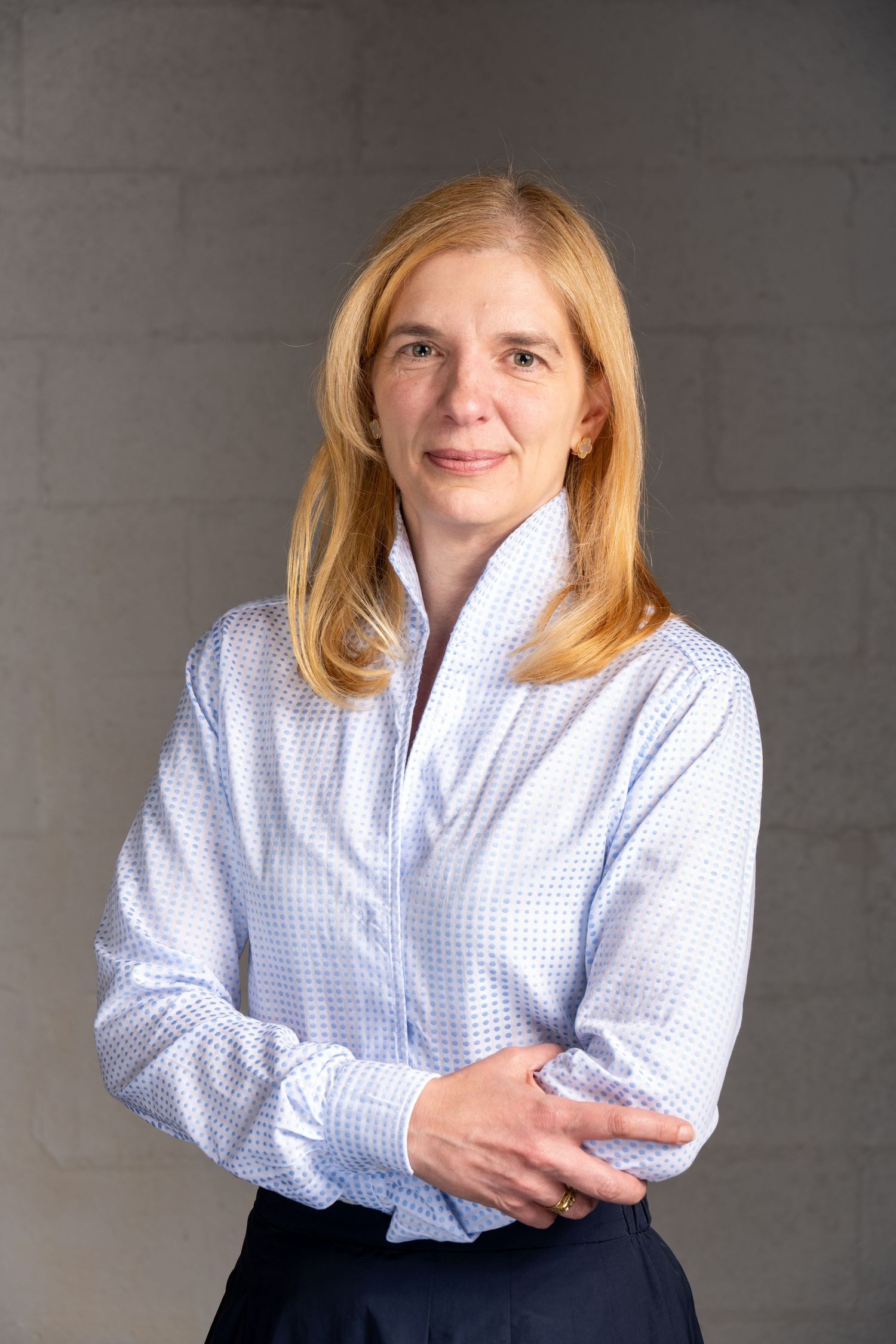 Studio headshot of professional woman in soft light, photographed for executive branding and corporate profiles.