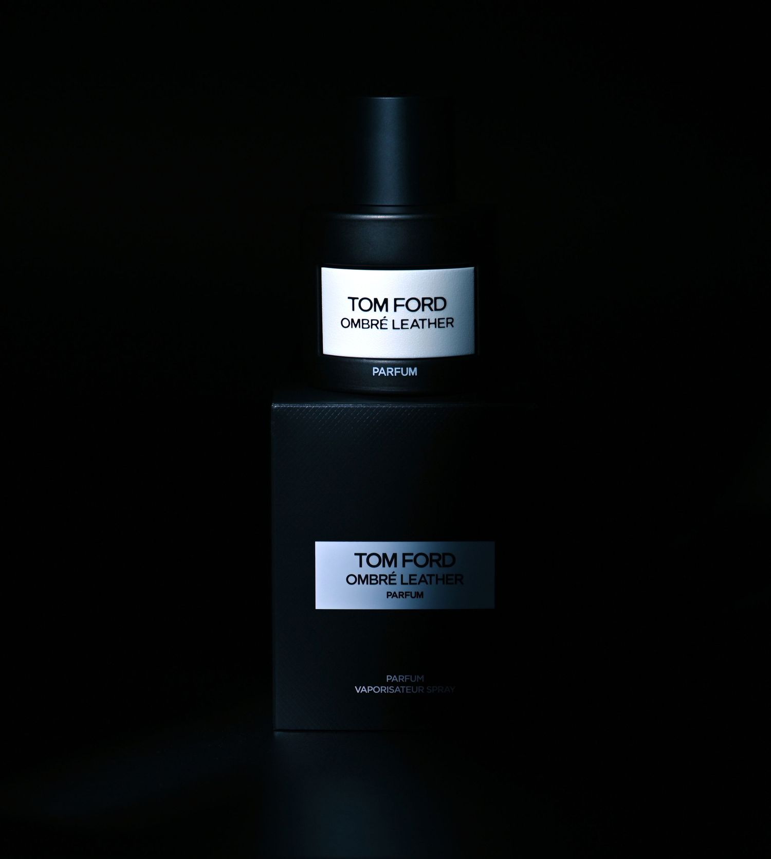 Tom Ford Ombré Leather Parfum bottle photographed with dramatic lighting for luxury fragrance branding.
