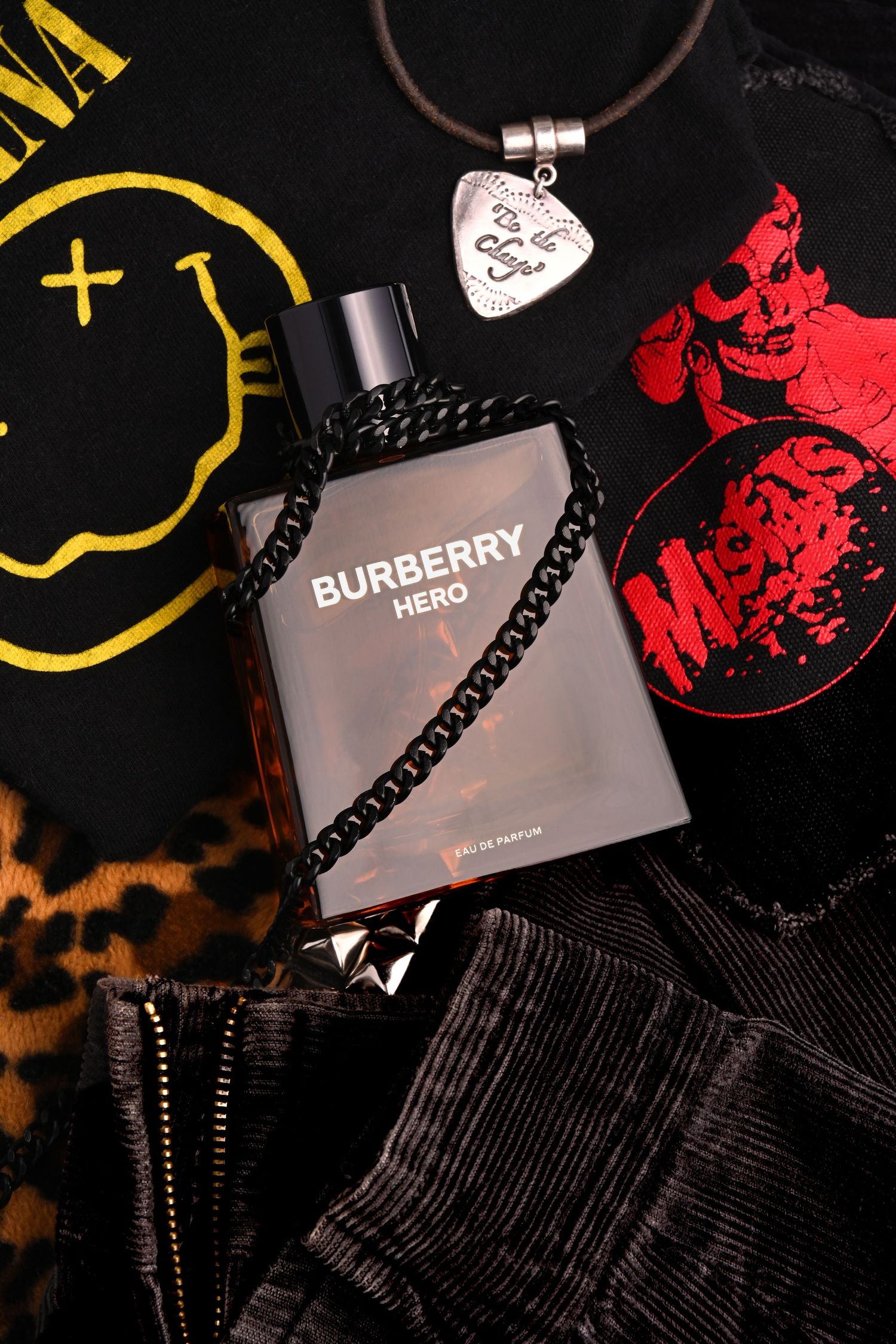 Burberry Hero eau de parfum styled with fashion accessories, photographed for luxury fragrance advertising.