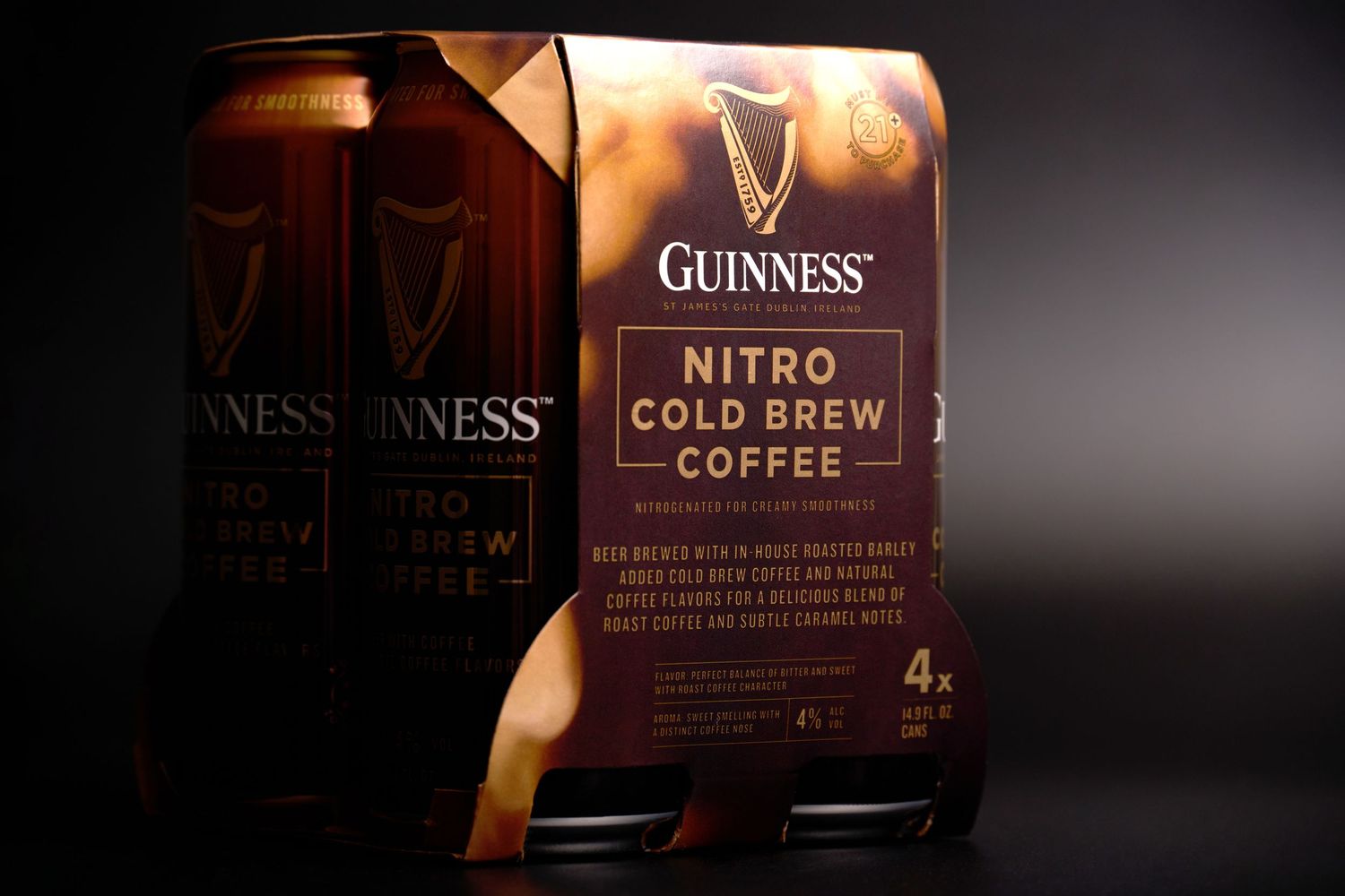 Guinness Nitro Cold Brew Coffee four-pack, photographed with dramatic lighting for beverage advertising and packaging.