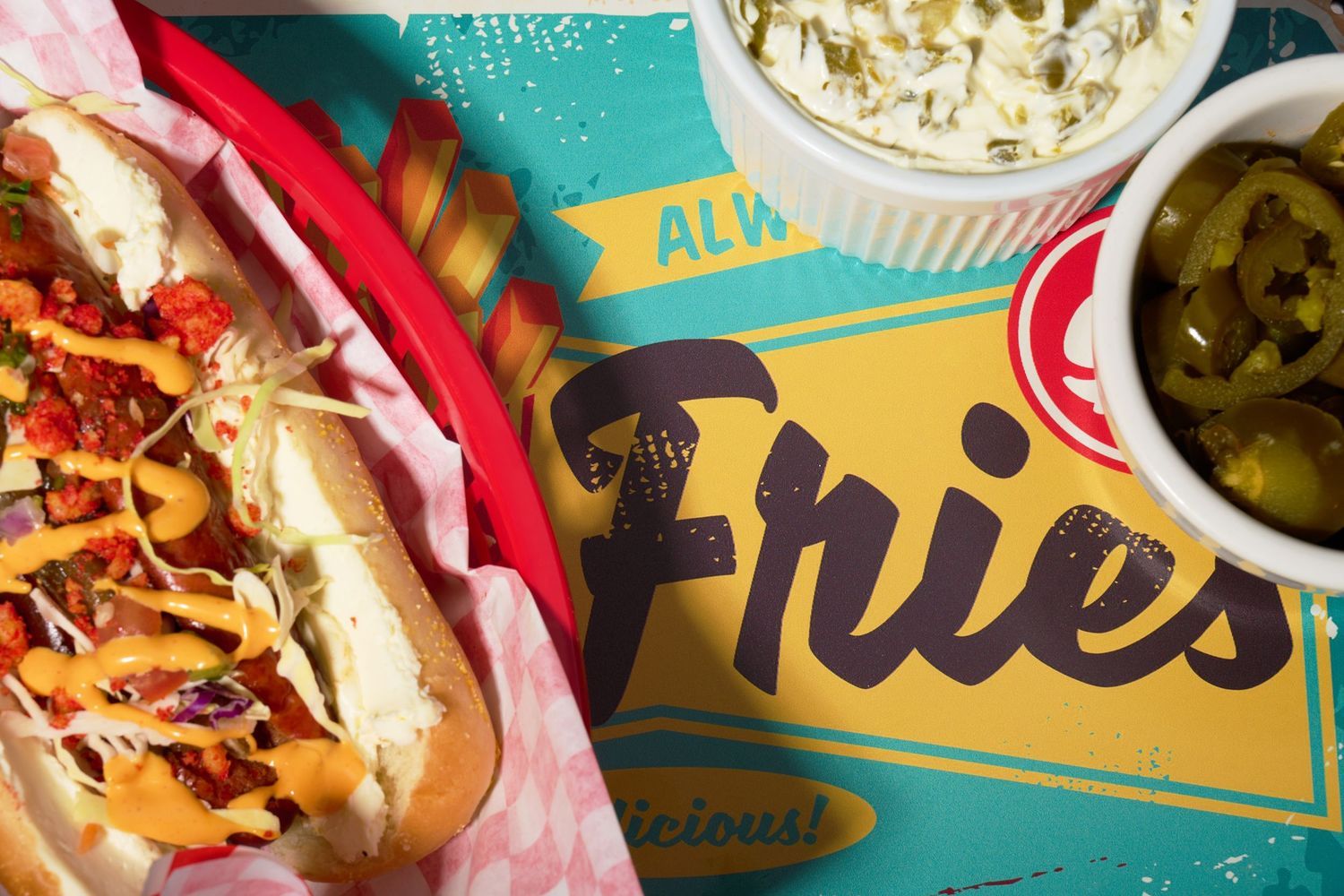 Loaded hot dogs and fries photographed overhead for restaurant menus, advertising, and social media content.