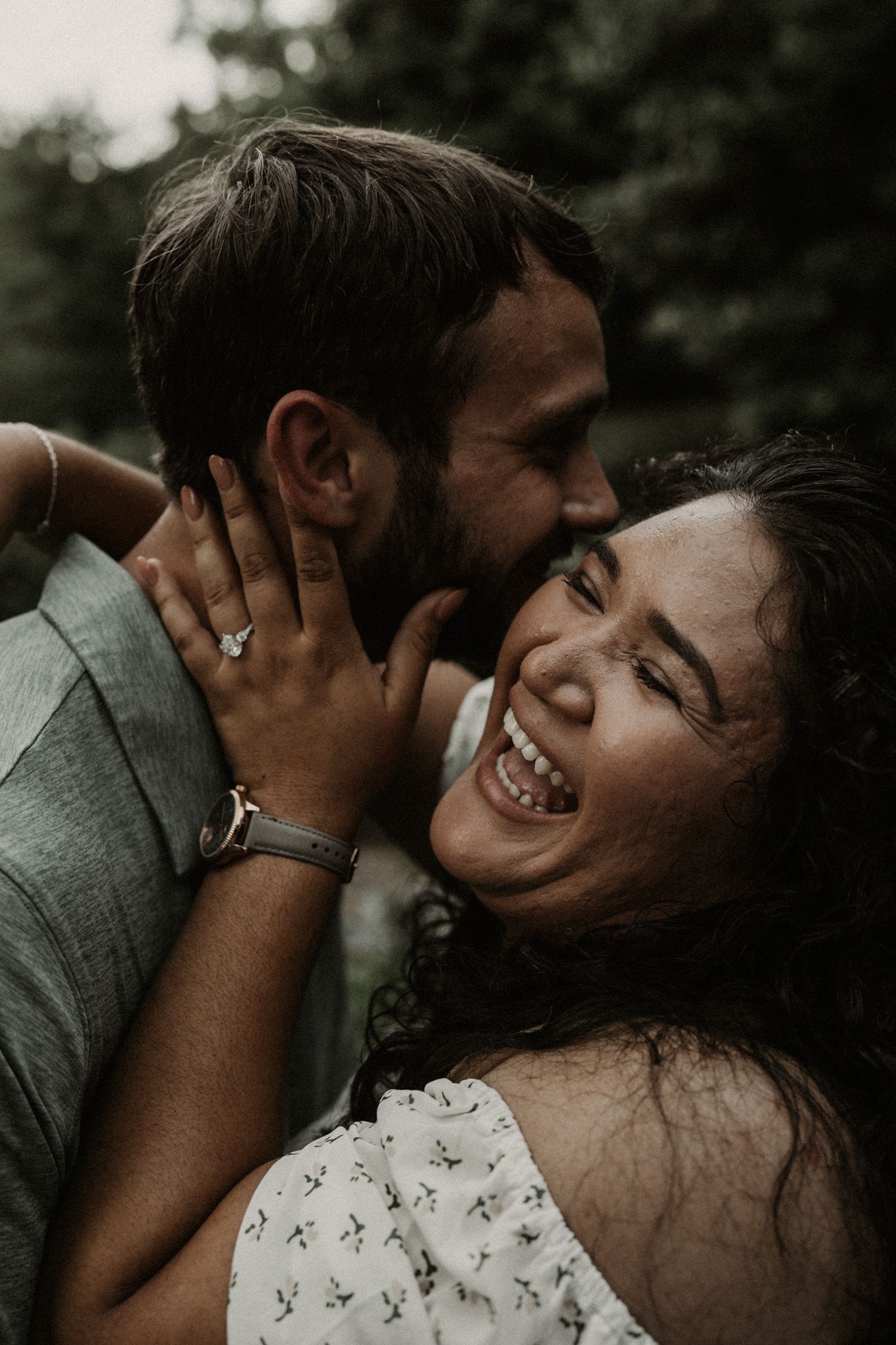 A romantic couple shares intimate candid moments in a series of dark moody photographs.