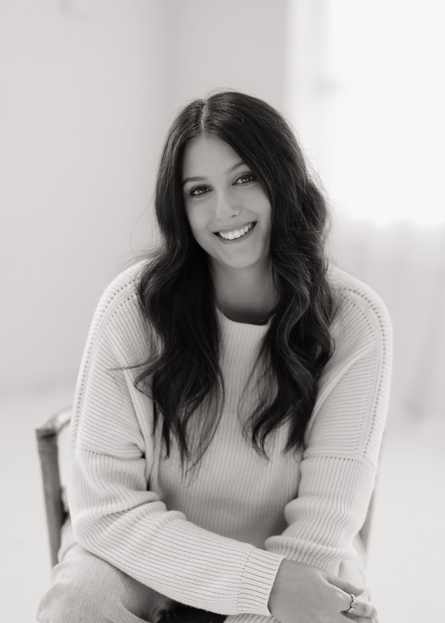 Portrait series showing natural expressions in a bright white studio setting.