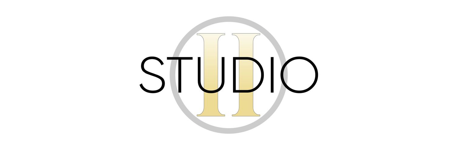 Studio II logo displaying gold Roman numeral II within a gray circle on white background.