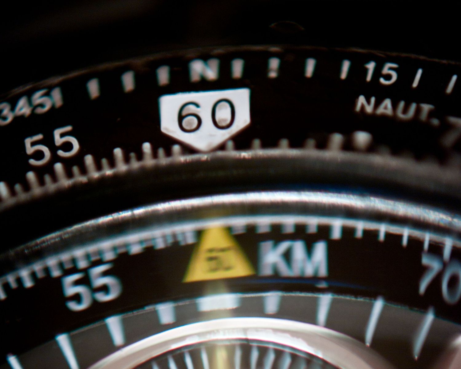 Close-up of vintage watch dial showing 60 marking with nautical scale.