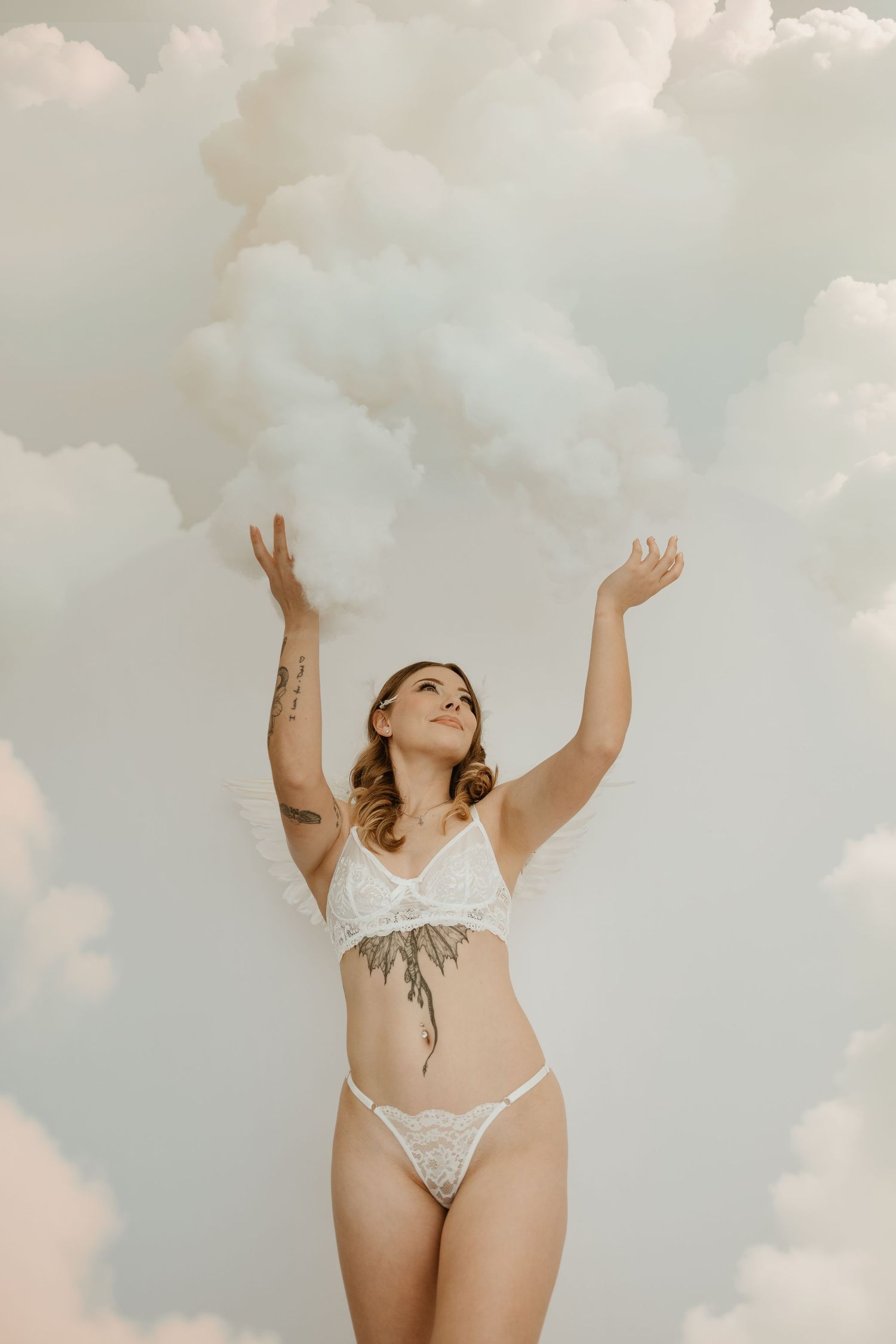Dreamy bridal boudoir portrait with angel wings by Fort Campbell and Nashville boudoir photographer.