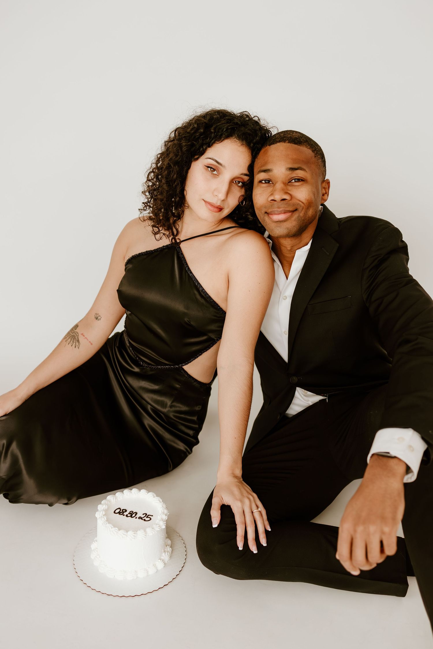 Elegant engagement portrait of a couple with wedding date cake in Clarksville, Tennessee. wedding photography in clarksville