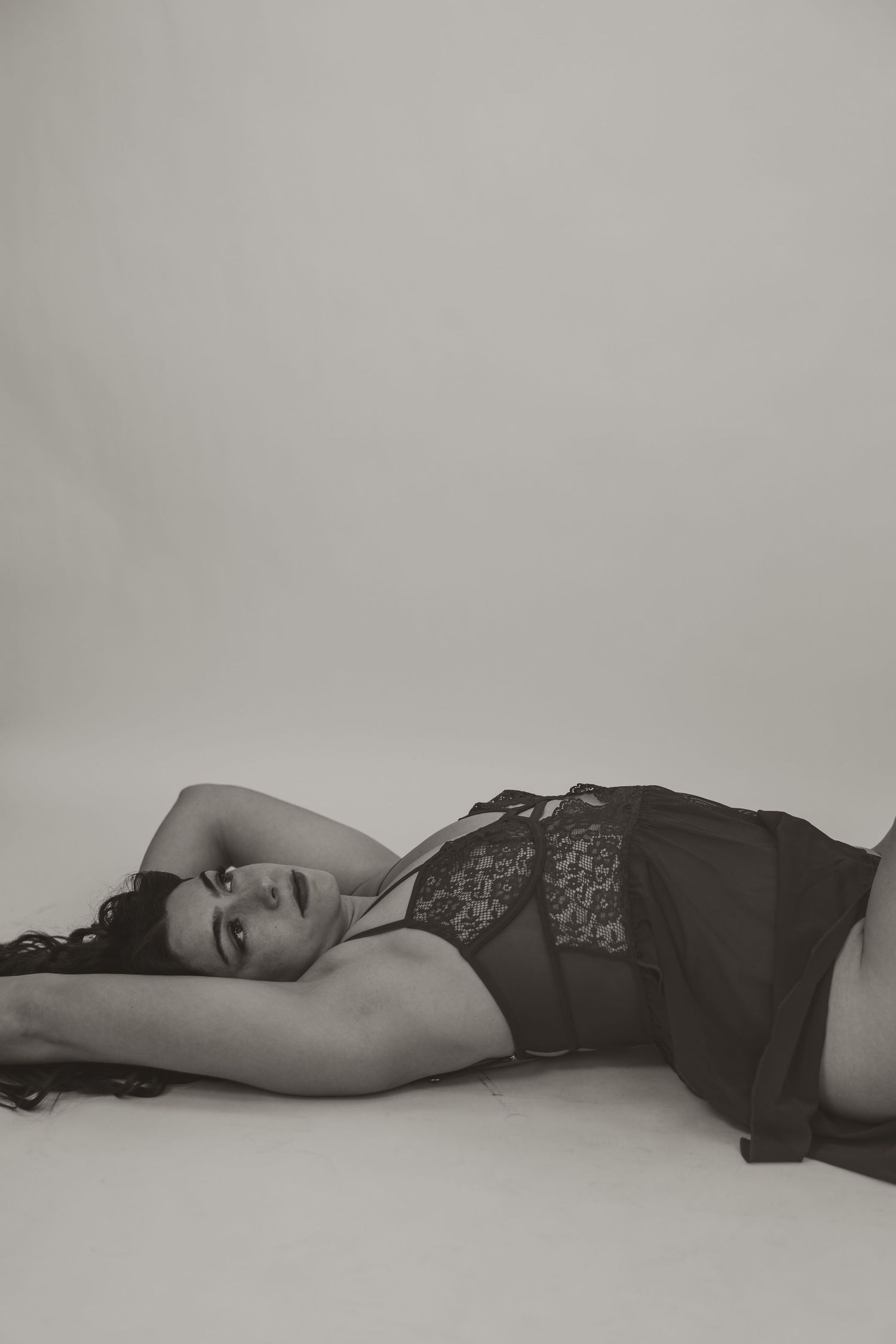 Romantic boudoir session with luxury styling and warm neutral tones near Fort Campbell and Clarksville