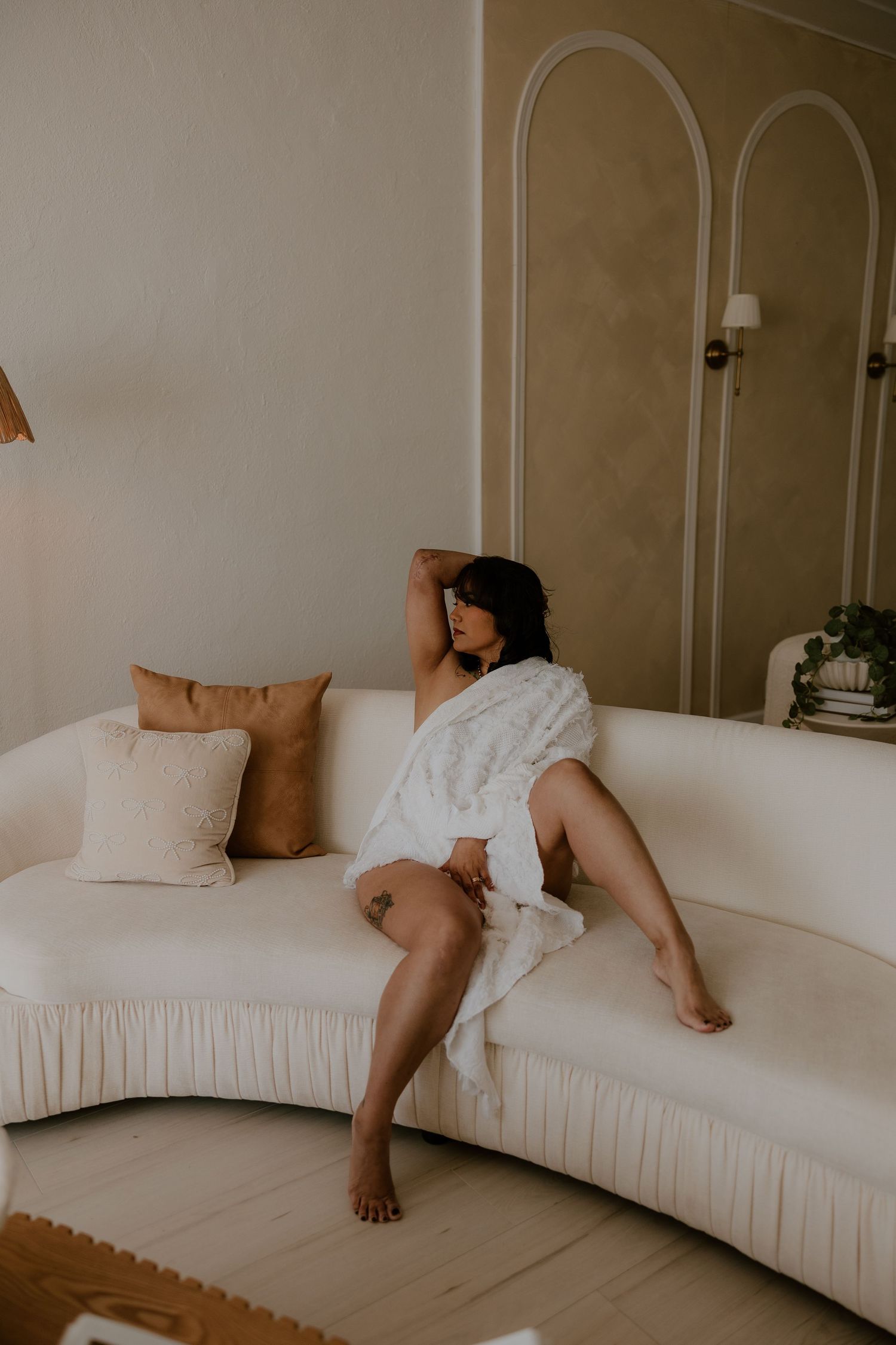 Luxury boudoir session with warm neutral tones and romantic styling by Clarksville boudoir photographer. whimsical and cinematic boudoir