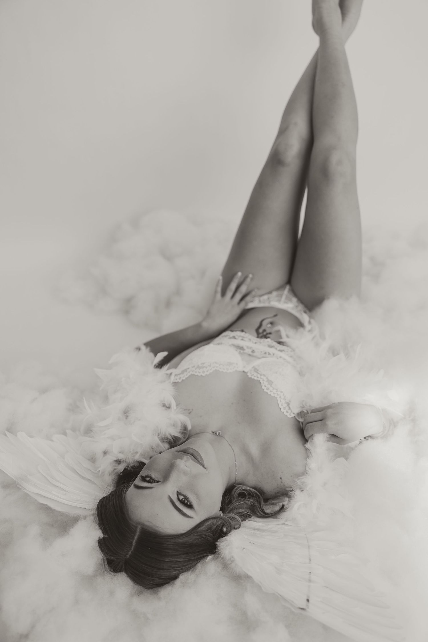 Black and white boudoir photo with angel wings in Clarksville and Fort Campbell studio.