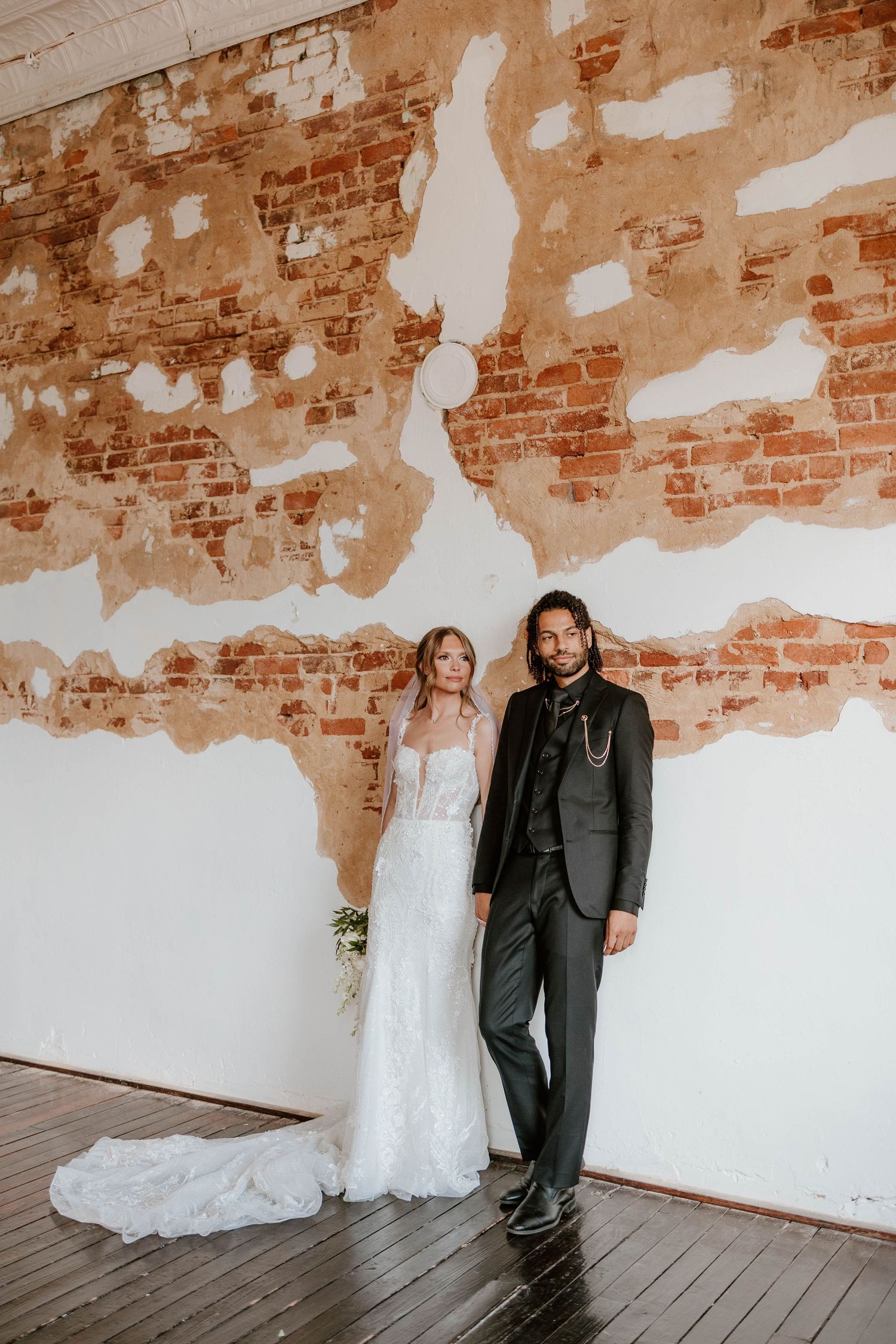 Light and airy wedding portrait of bride and groom by a window inside a historic Middle Tennessee wedding venue