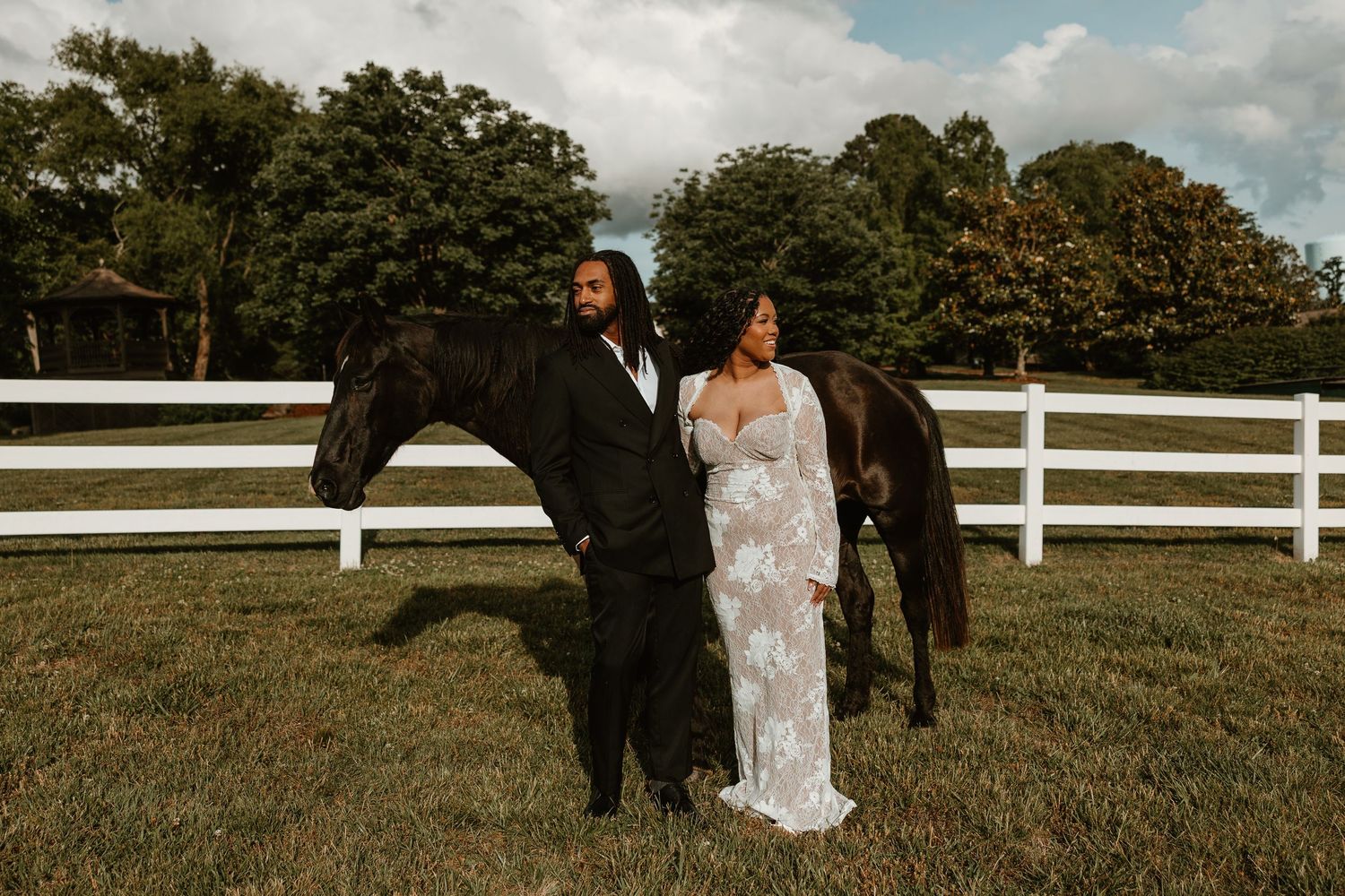 Romantic Southern engagement session featuring a couple and horse at a Clarksville wedding venue.