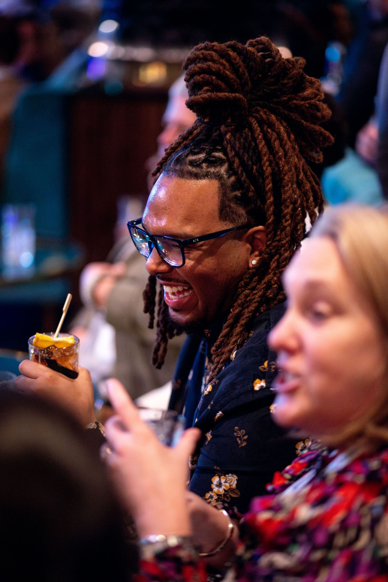 Man laughing at a sales event.