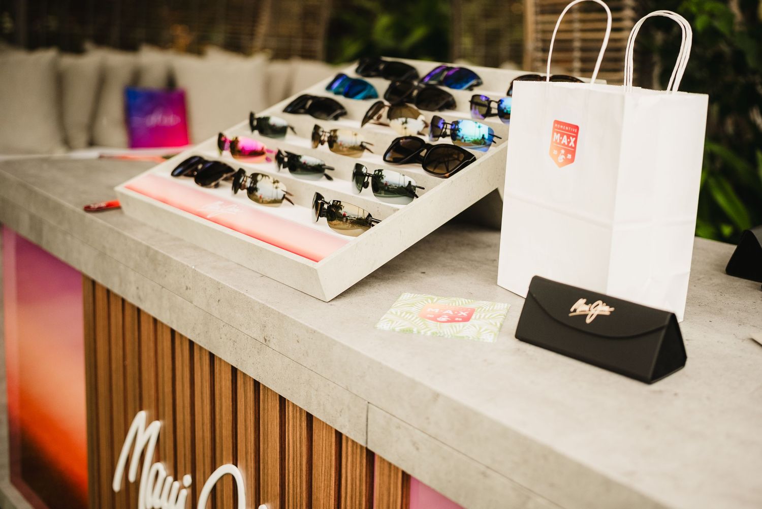 Maui Jim sunglasses on display along with event branded materials.