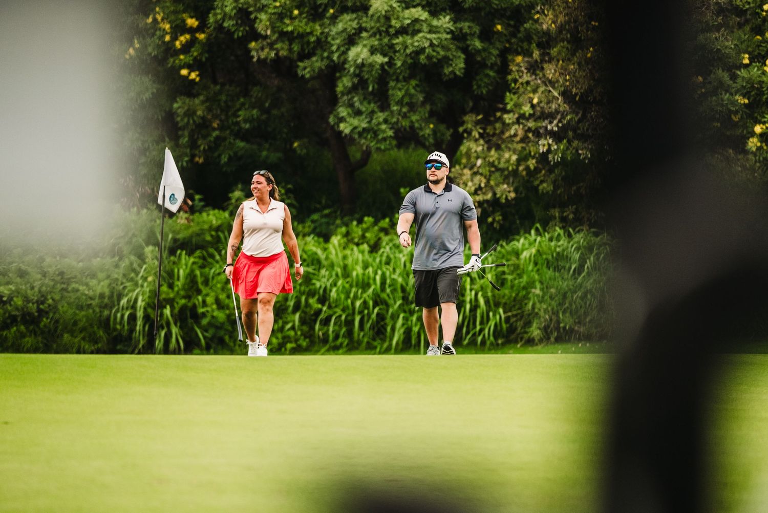 Photo of 2 golfers walking at a golfers course in Lanai Hawaii for a sales incentive trip captured by Fantasma Imagery