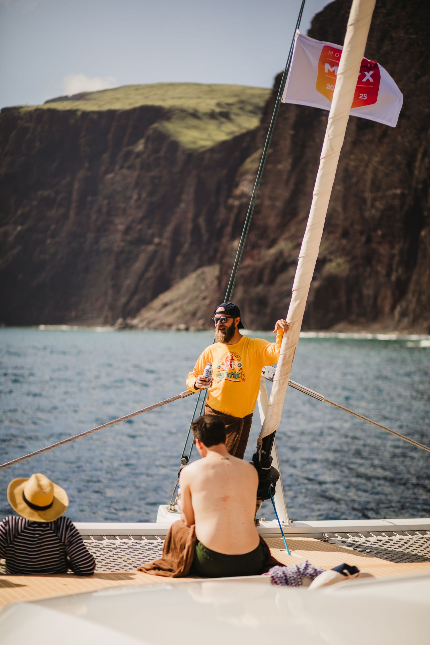 Photo of a man smiling on a boating event activity for a sales incentive trip.