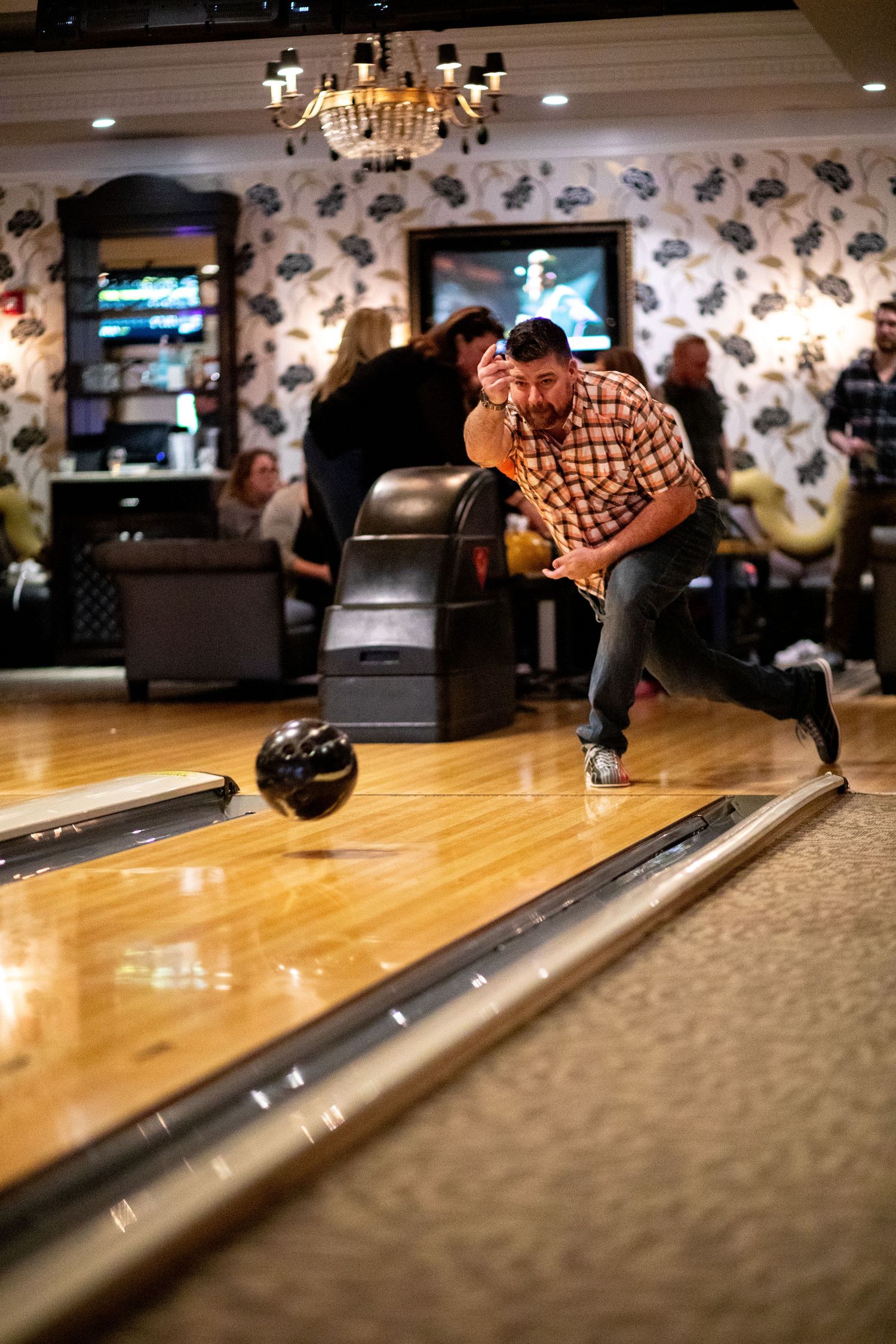 Man bowling at an event.