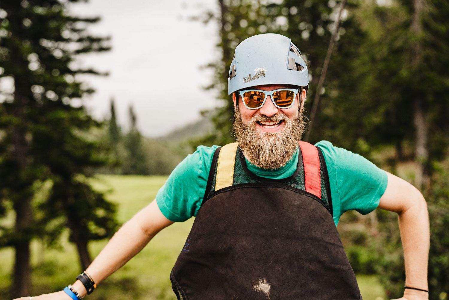 Photo of a man smiling at the camera before doing a zipline in Lanai Hawaii for a sales incentive trip captured by Fantasma Imagery