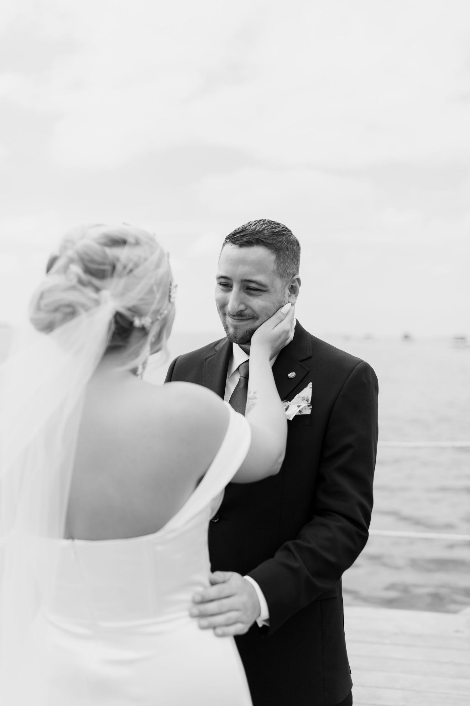 Colorado & destination wedding photographer capturing candid bride and groom moments during an emotional wedding day celebration.