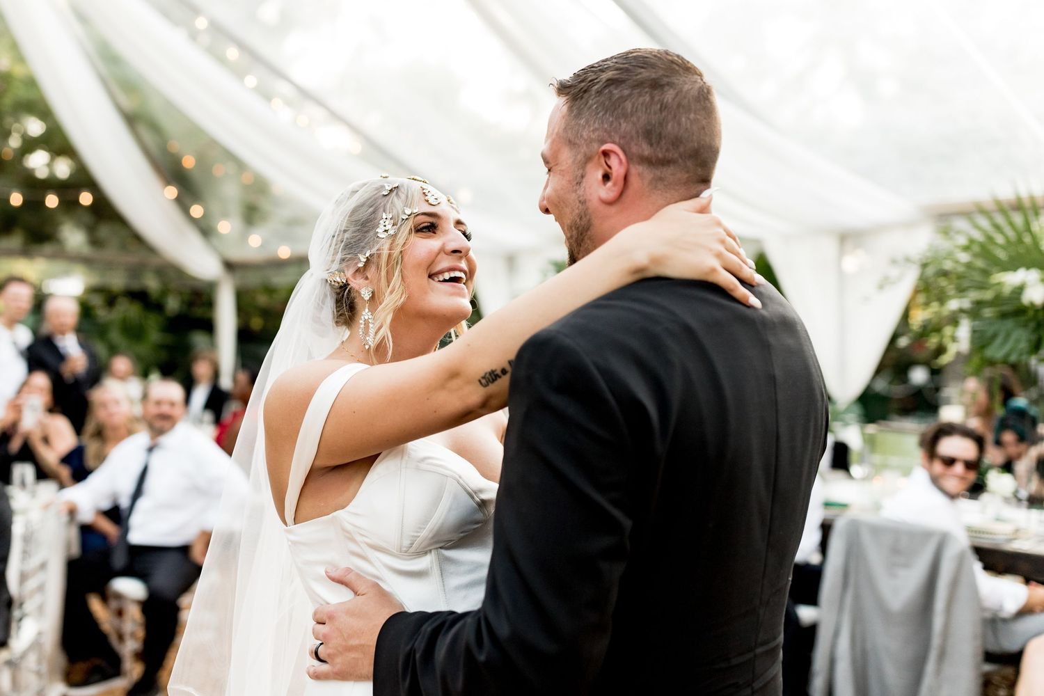 Colorado & destination wedding photographer capturing candid bride and groom moments during an emotional wedding day celebration.