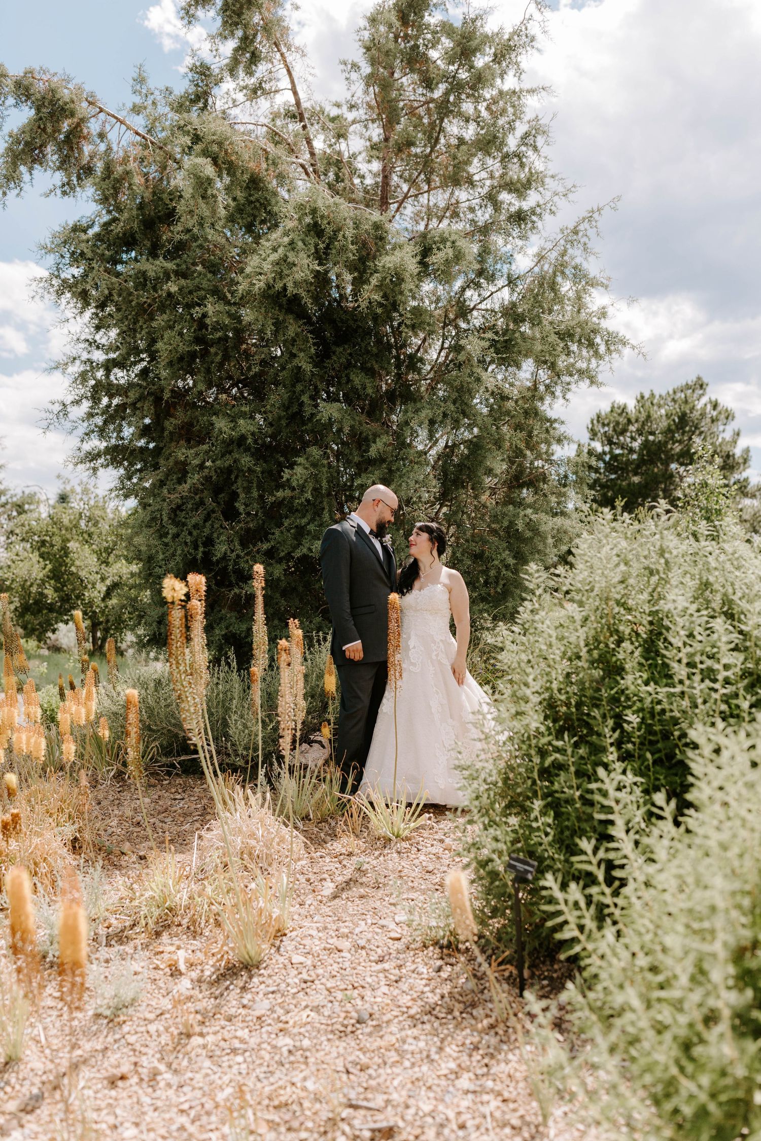 Colorado & destination wedding photographer capturing candid bride and groom moments during an emotional wedding day celebration.