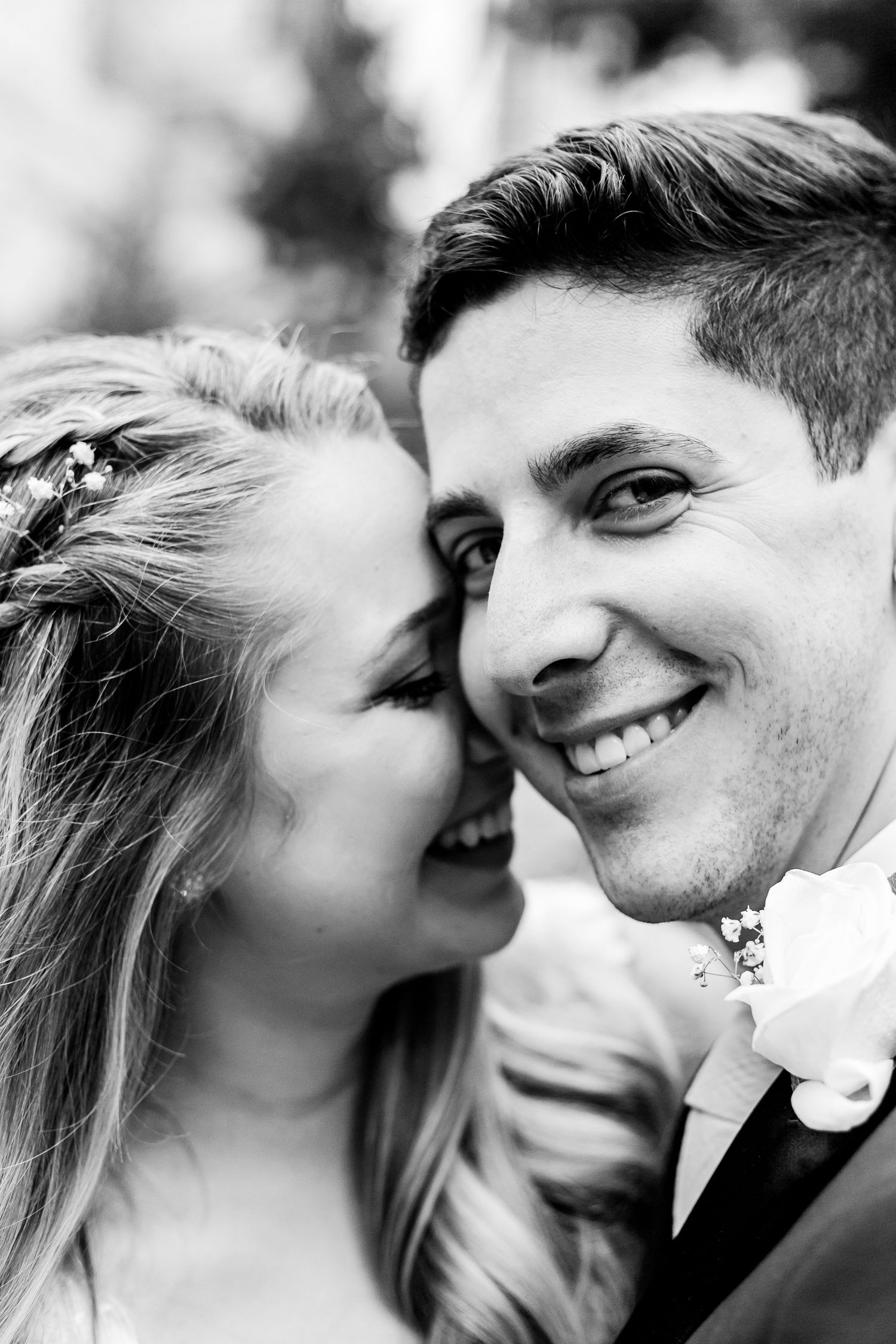 Colorado & destination wedding photographer capturing candid bride and groom moments during an emotional wedding day celebration.