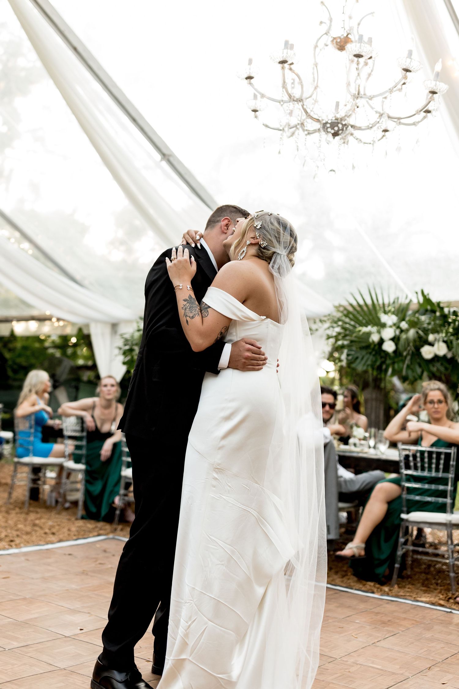 Colorado & destination wedding photographer capturing candid bride and groom moments during an emotional wedding day celebration.