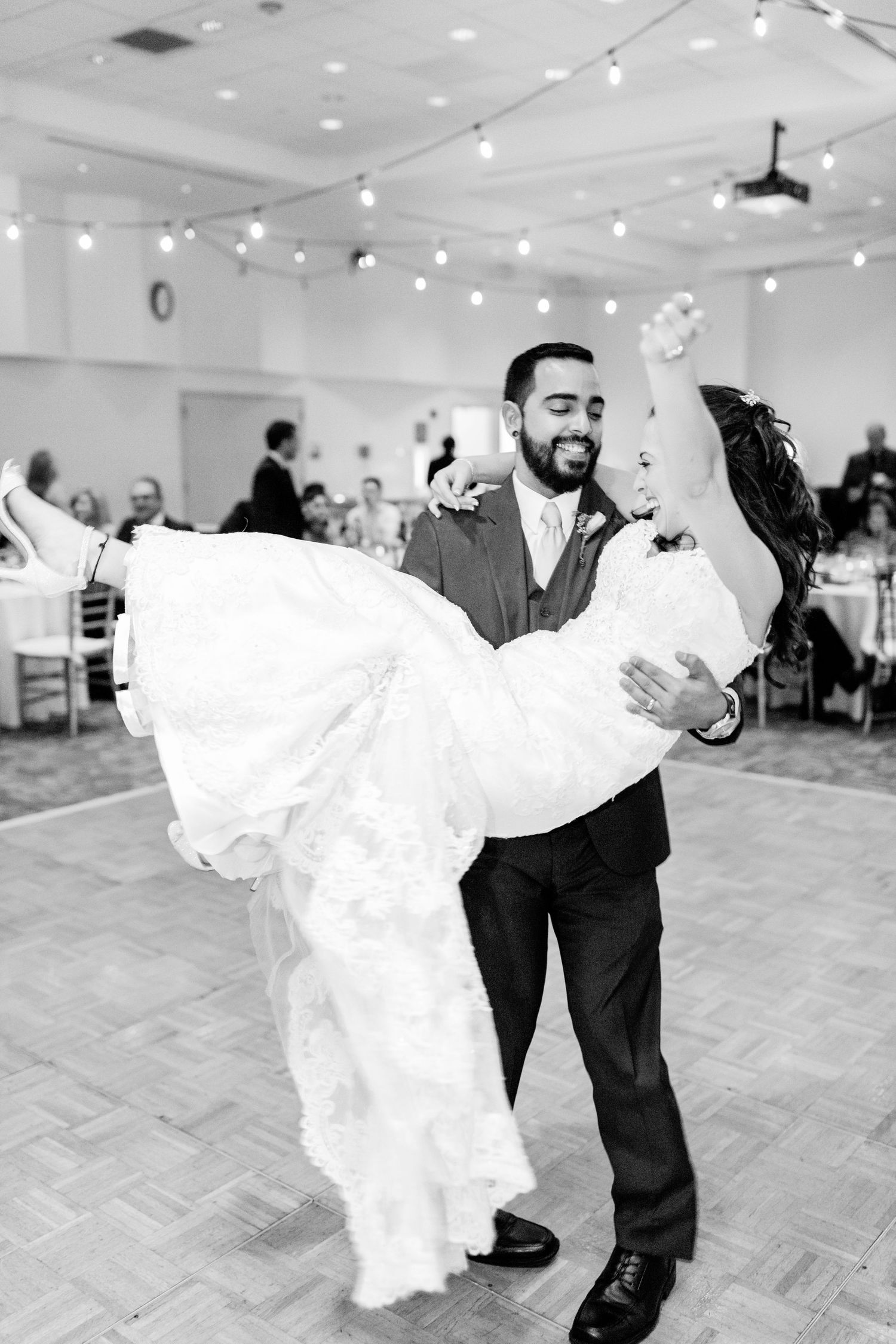 Colorado & destination wedding photographer capturing candid bride and groom moments during an emotional wedding day celebration.