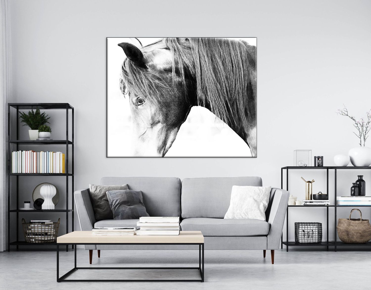 Black and white horse portrait canvas wall art displayed above a gray sofa in a modern living room.