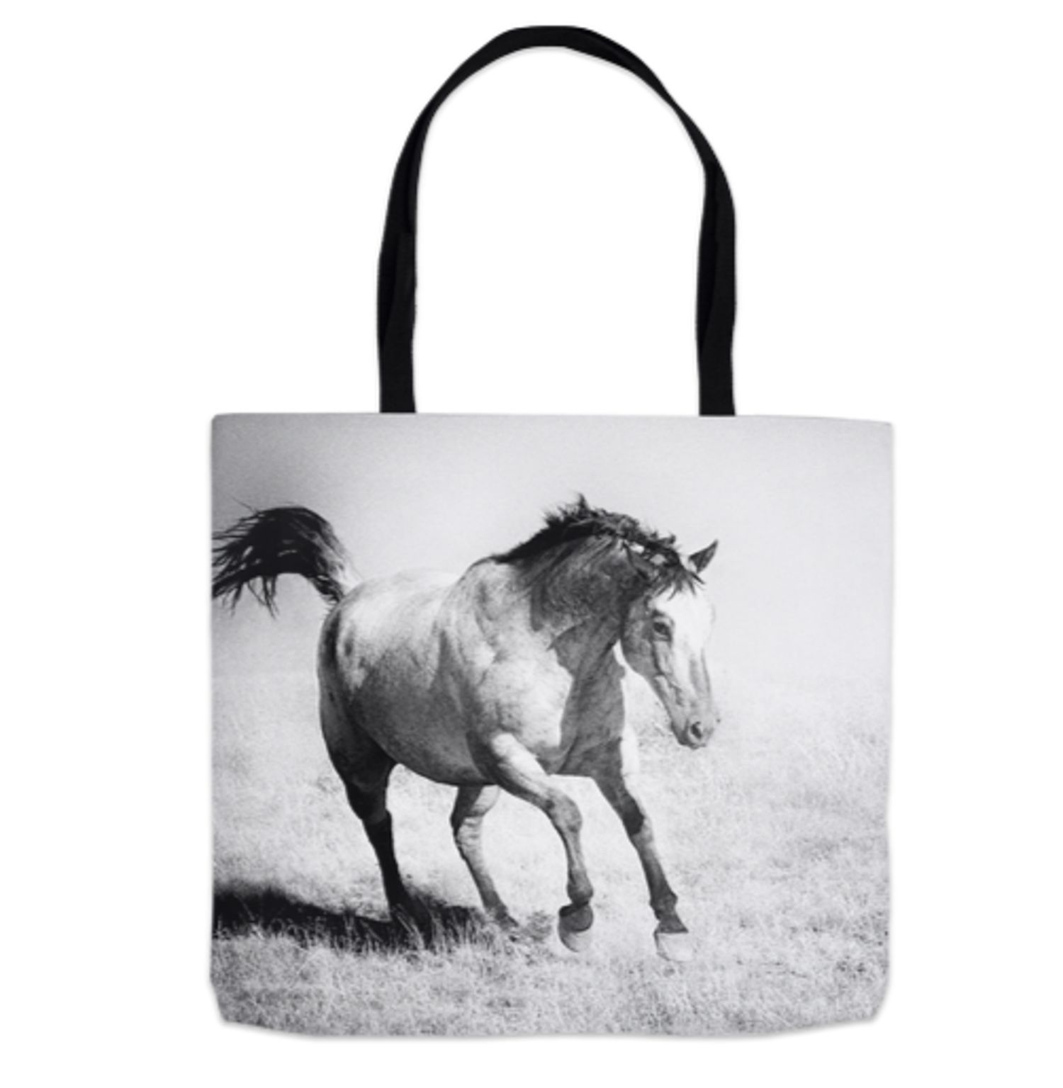 Black and white tote bag featuring a galloping horse in a field, with black handles.