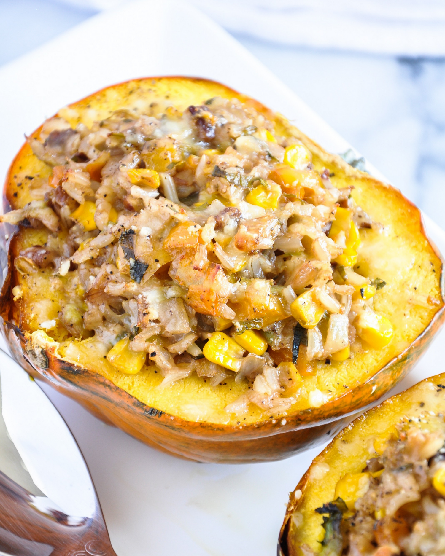 Stuffed butternut squash boats filled with savory meat and vegetables.