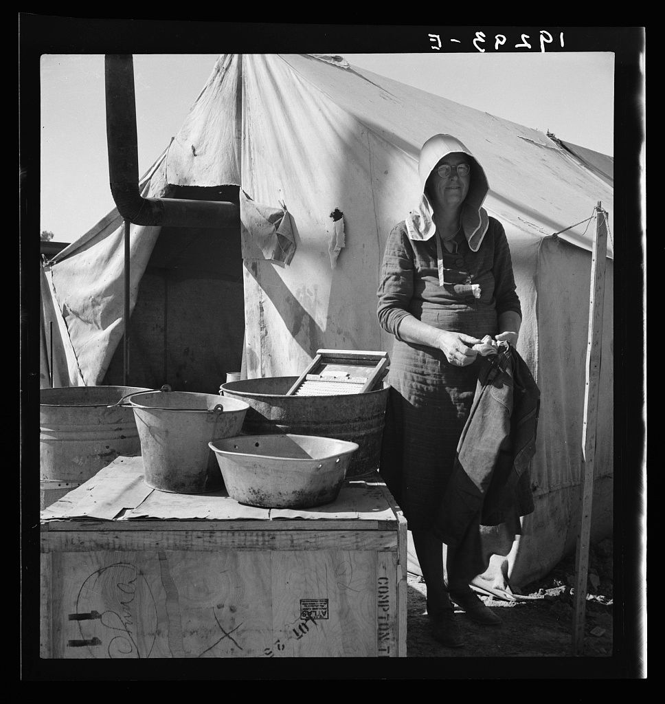 Black and white photos showing medical staff preparing supplies in a field hospital tent setting.