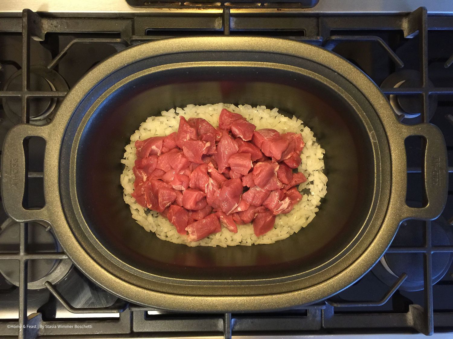 Cooking progression showing raw meat being added to rice in a black oval serving dish.