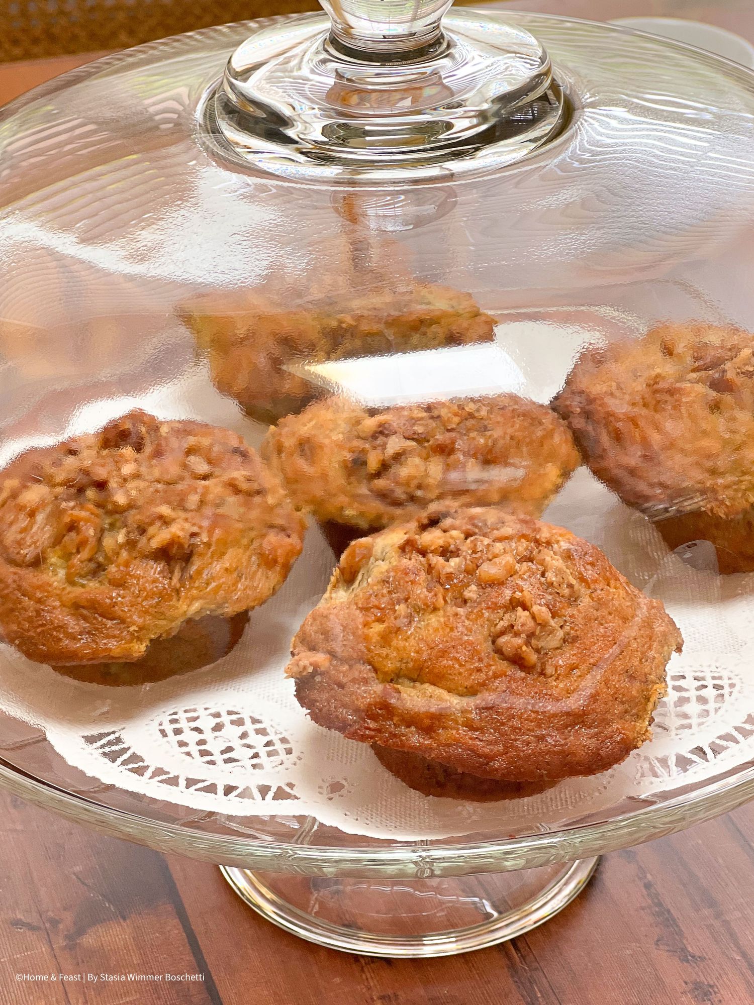 Homemade cookies displayed on a glass serving platter with lace-like pattern.