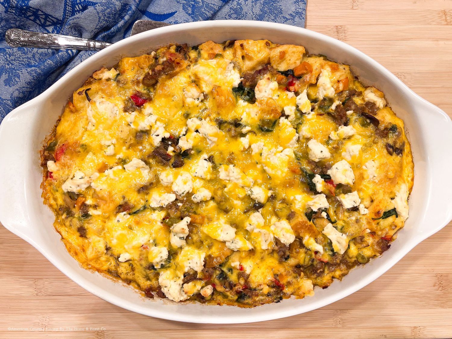 Cheesy vegetable casserole with golden brown top in white baking dishes.