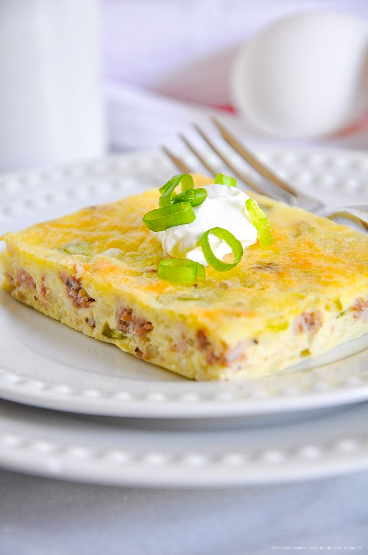 Slices of golden quiche with bacon and green onion garnish served on white plates.