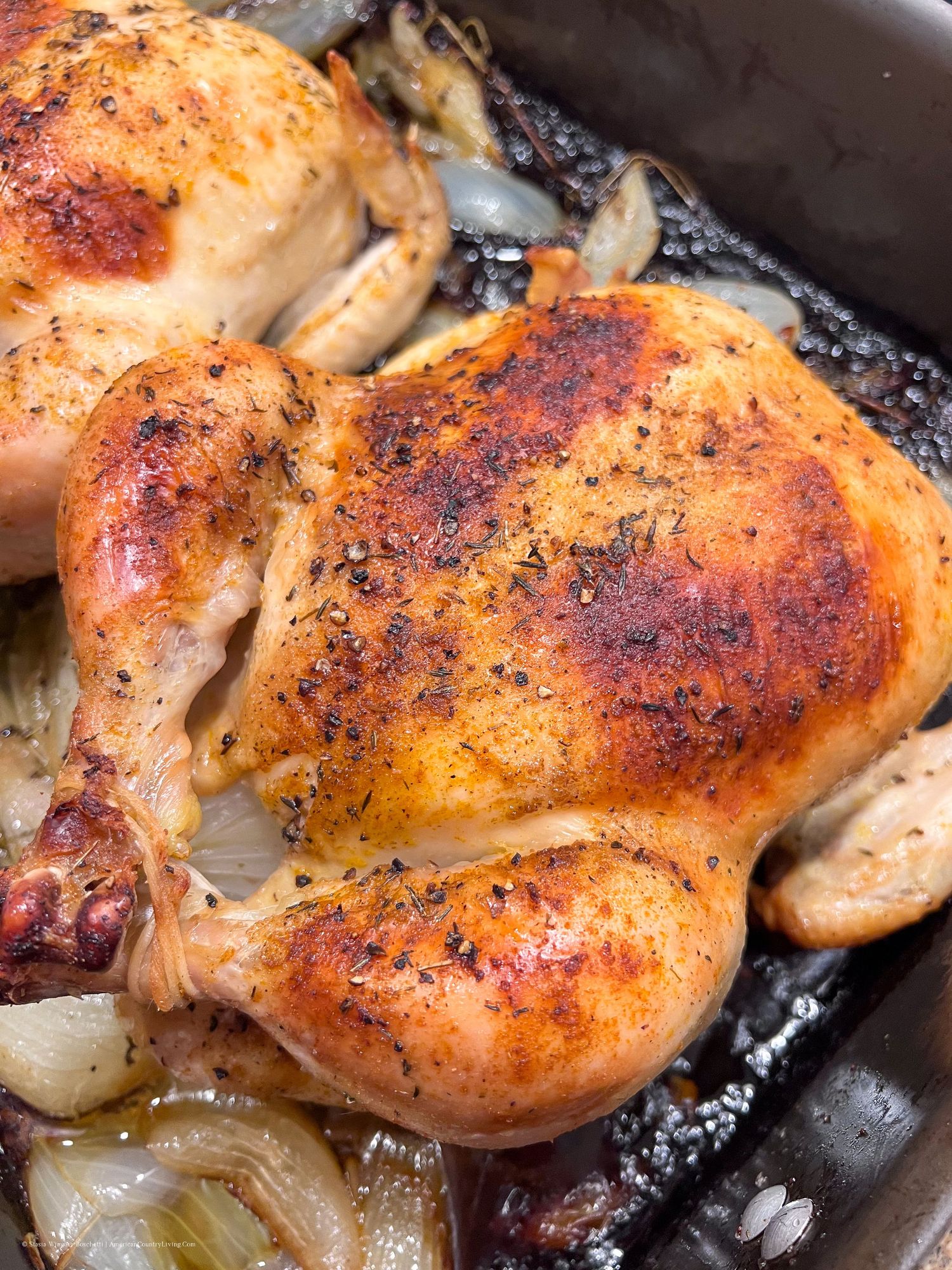 Perfectly roasted chicken thighs with crispy skin and caramelized onions.