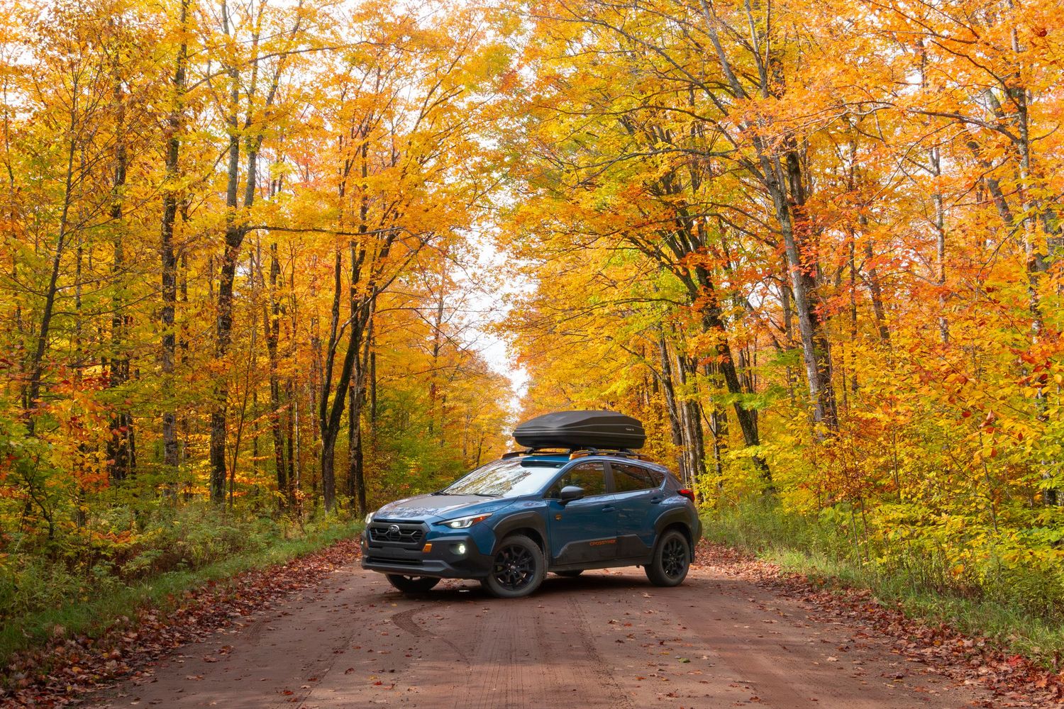 Subaru Crosstrek with cargo roof box in Michigan in the fall for LSPR