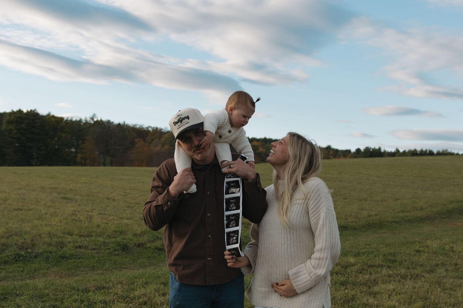 pregnancy announcement with family of three