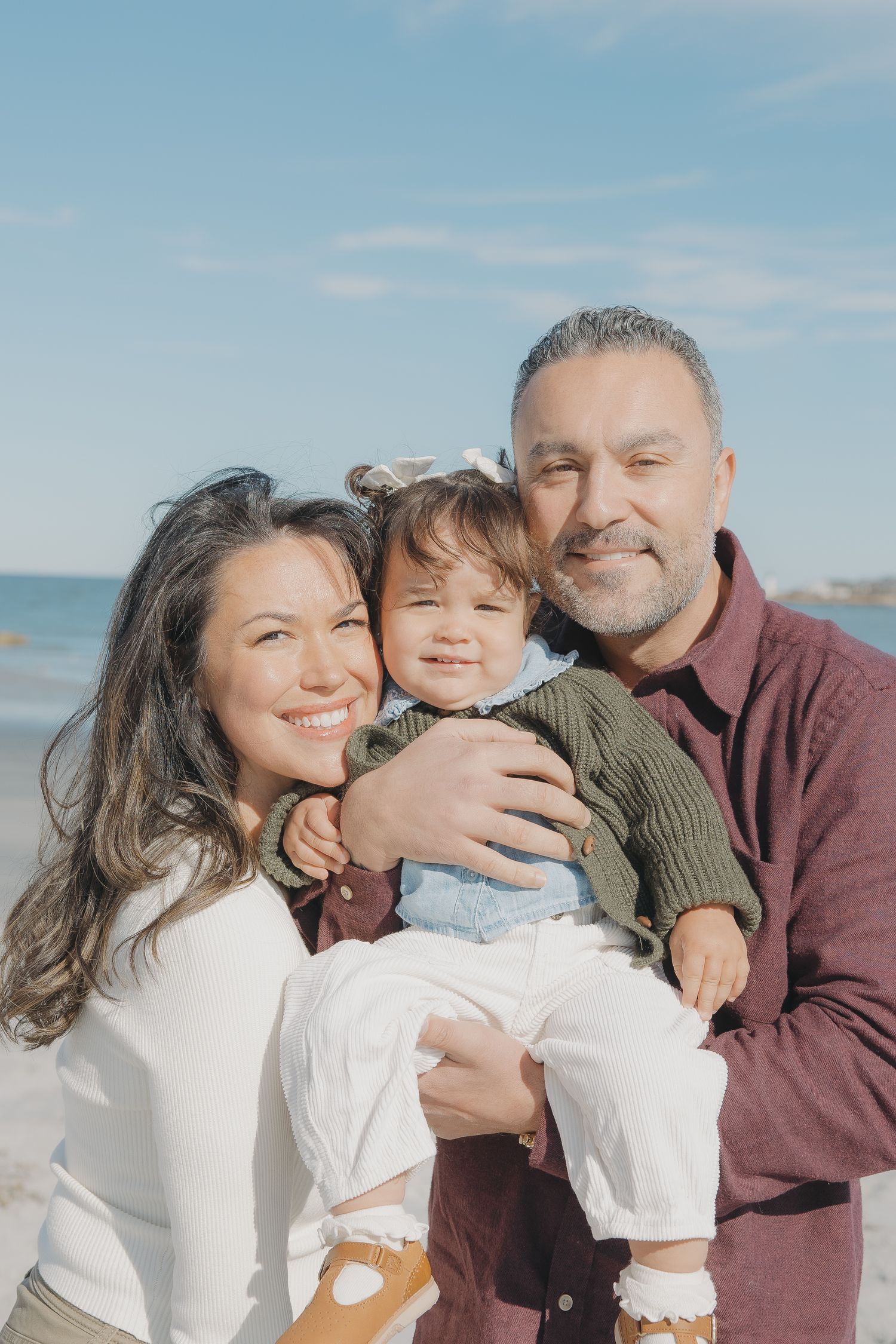 family on the beach during the winter