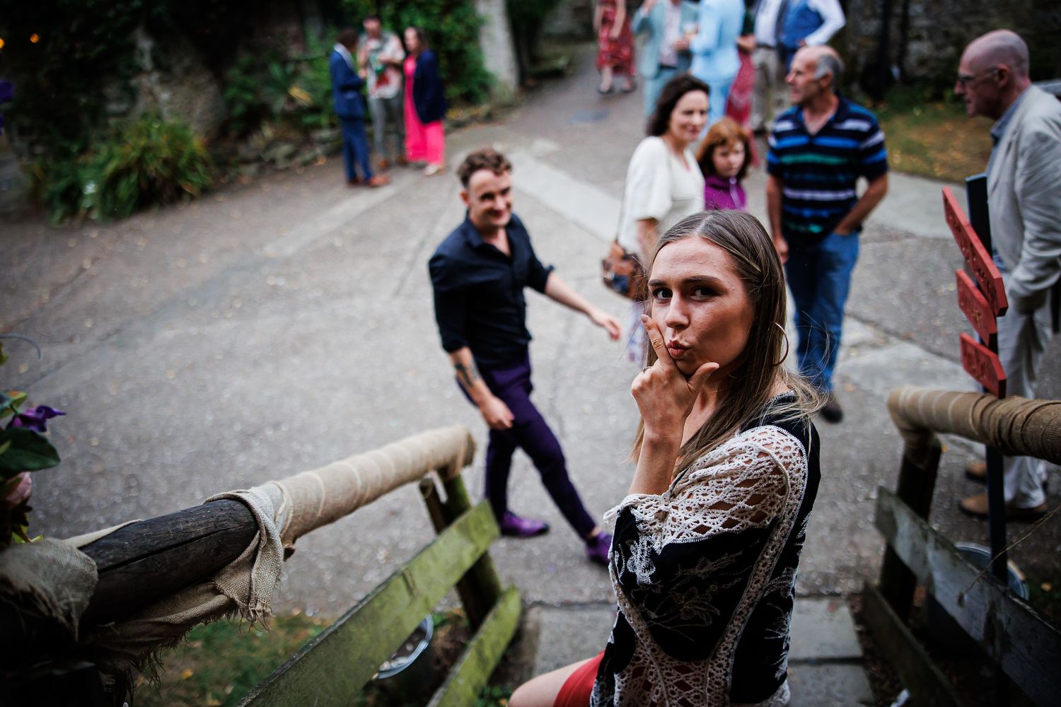 Candid shot of people gathered outdoors at a social event.