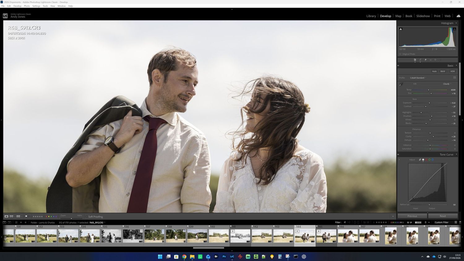 Wedding photo being edited in Adobe Lightroom showing smiling couple in outdoor setting.