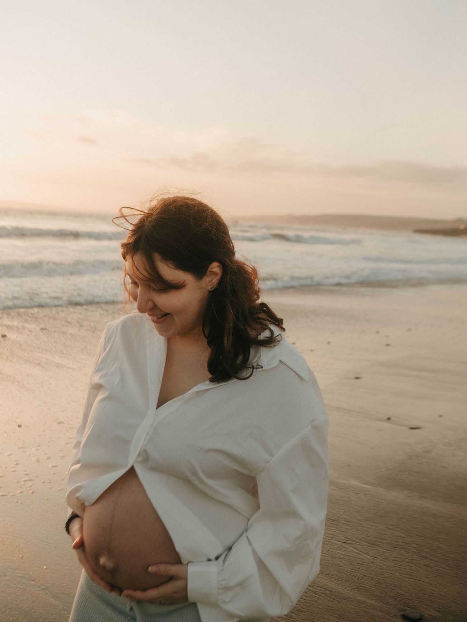 Photograph of pregnant woman at a beach in Cork