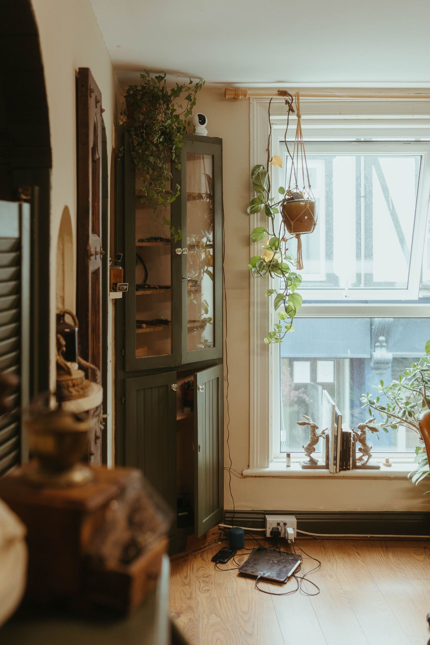 Photo of a tattoo studio showing some art and cabinets