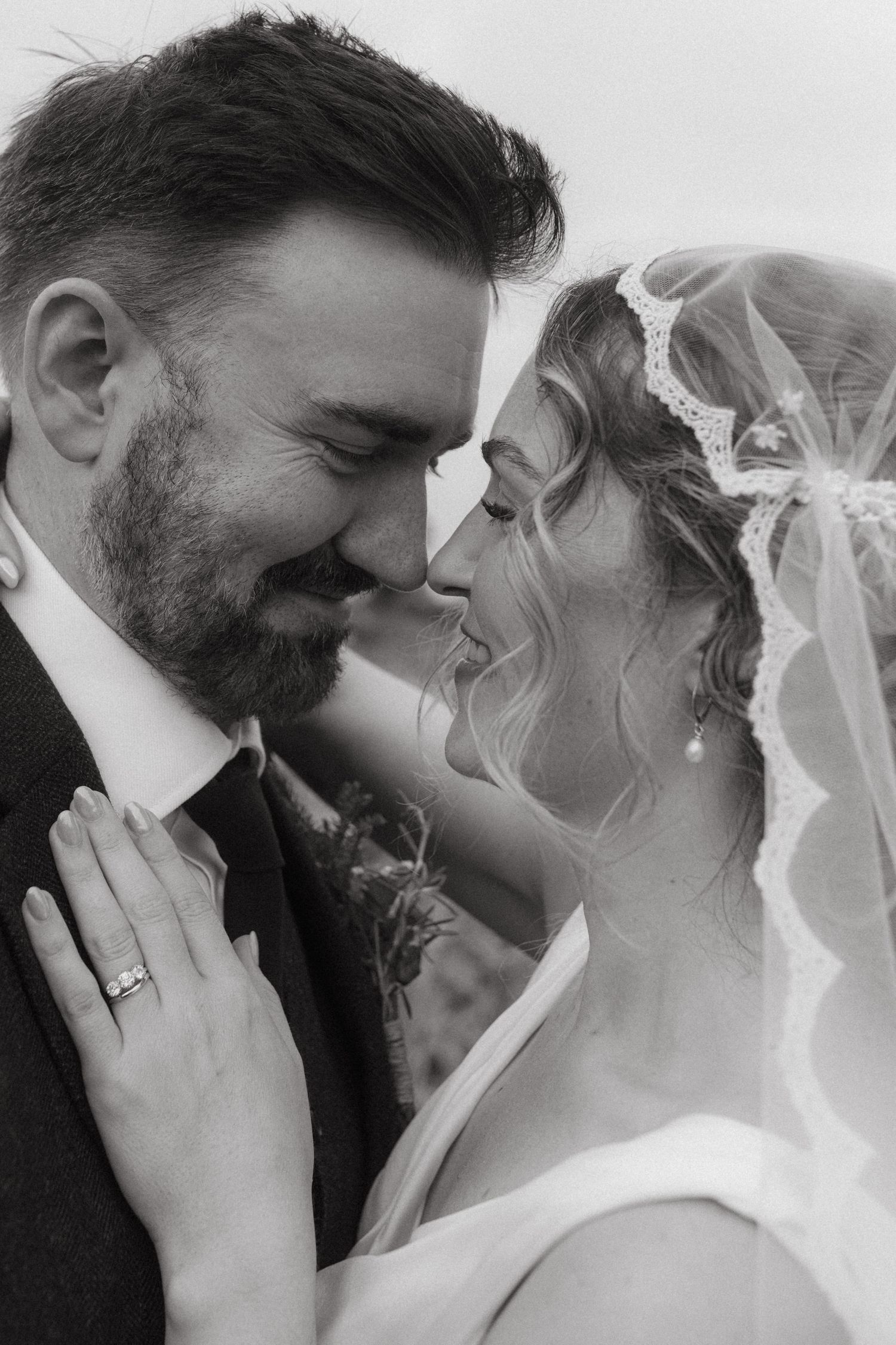 Black and white photograph of bride and groom during their bridal session