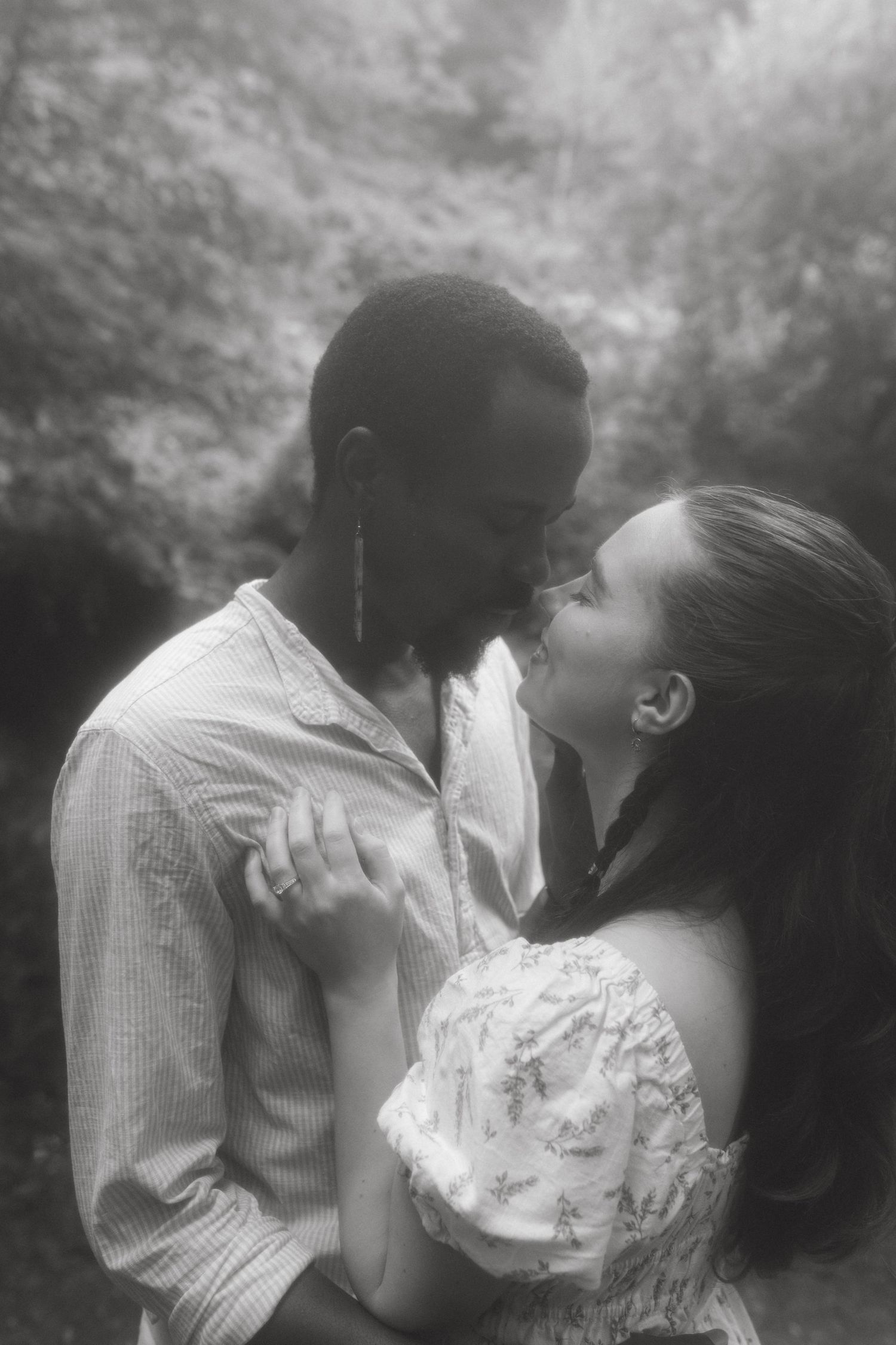 Black and white photograph of couple just before kissing