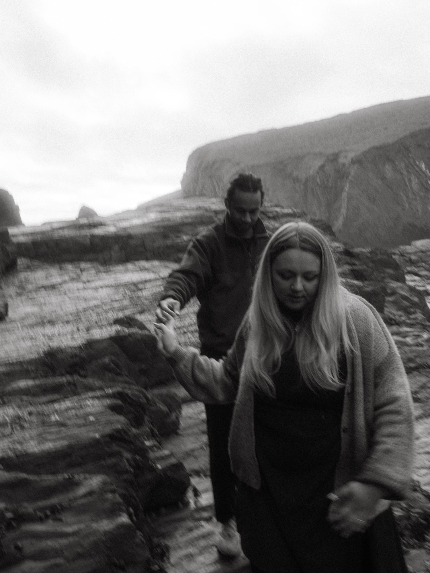 Photograph of couple posing at Nohoval Cove in Cork, Ireland.
