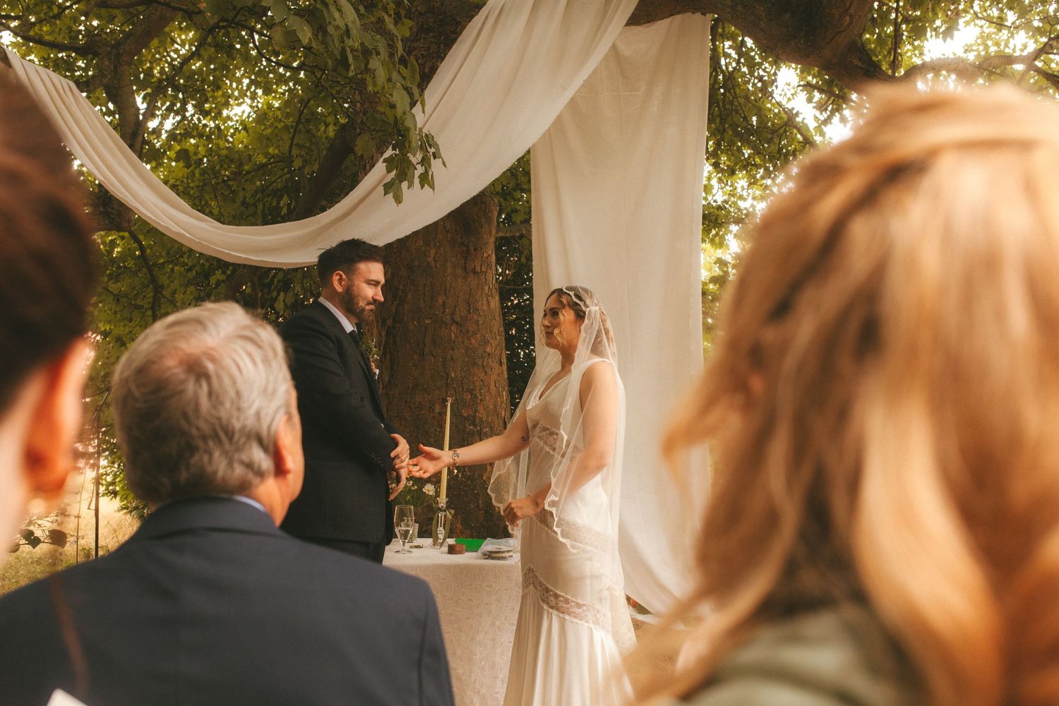Photograph of bride and groom during their ceremony