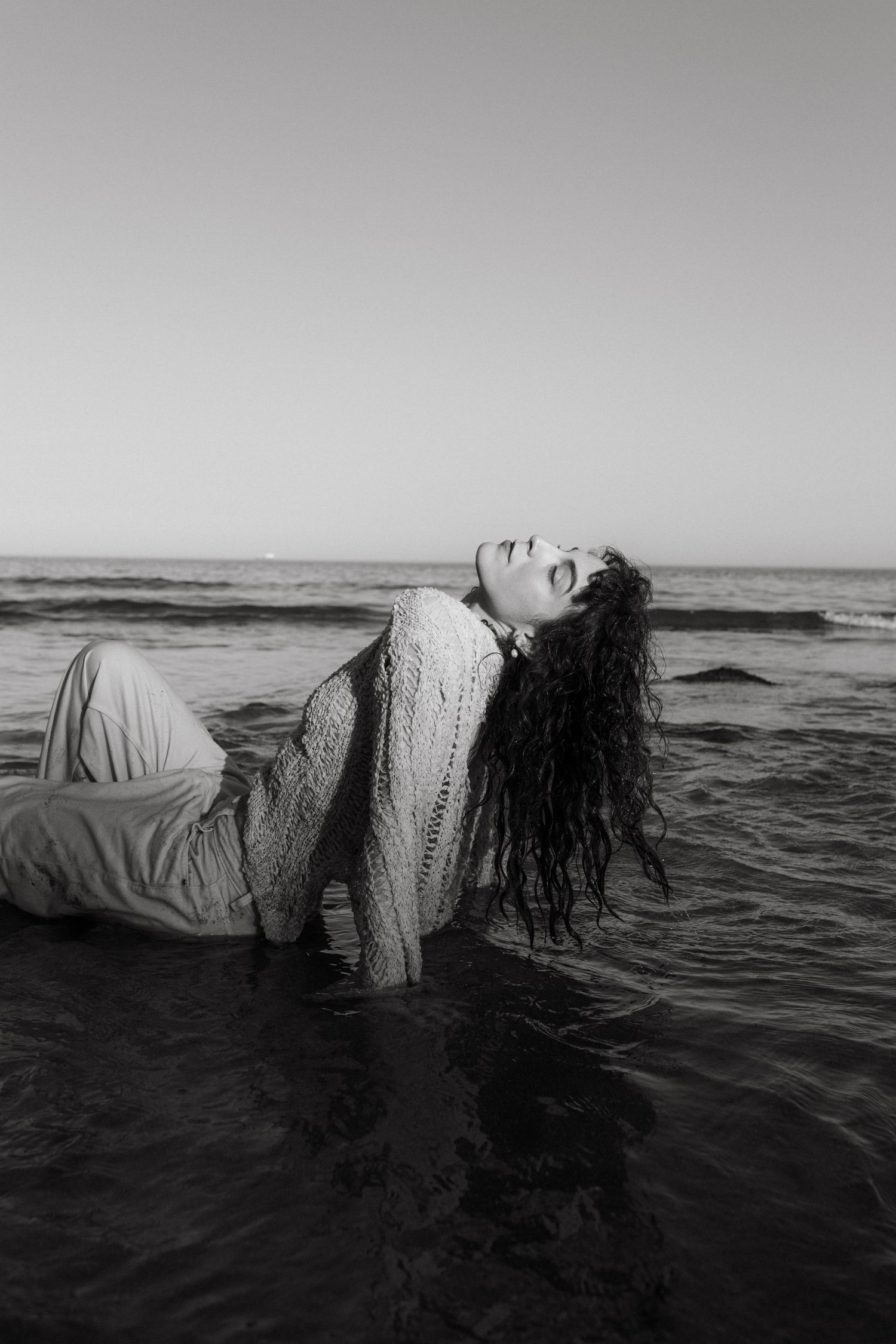 Portrait photograph of a model posing at Rocky Bay Beach in Cork.