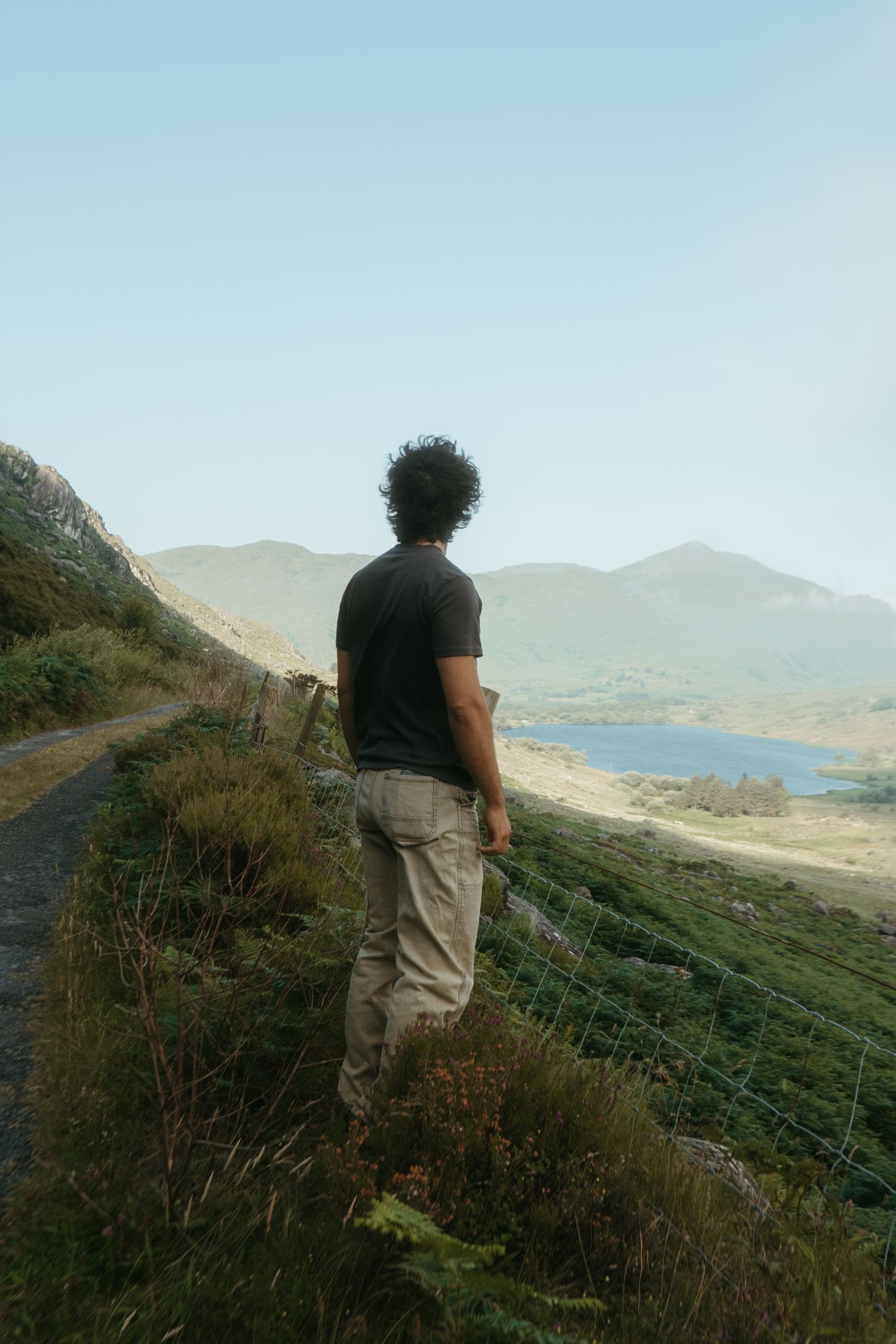 Young man standing on an Irish road in Kerry